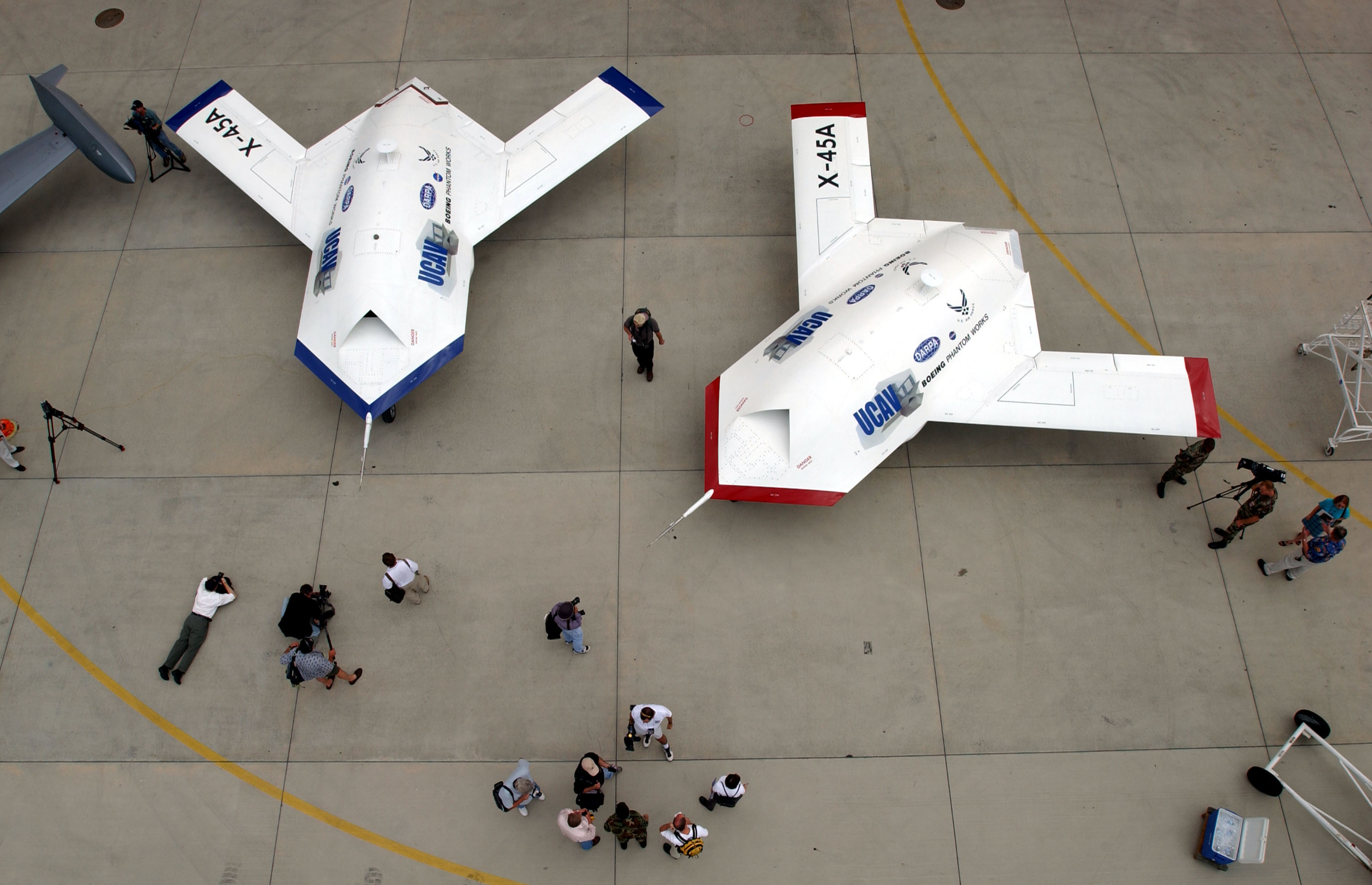 EDWARDS AIR FORCE BASE, CA - JULY 11: Two X-45A Unmanned Combat Air Vehicles (UCAV) are shown to members of the news media July 11, 2002 at Edwards Air Force Base, California. The X-45A, developed by The Defense Advanced Research Projects Agency and the Boeing Company, is the first unmanned system designed from inception for combat missions. (Photo by David McNew/Getty Images)