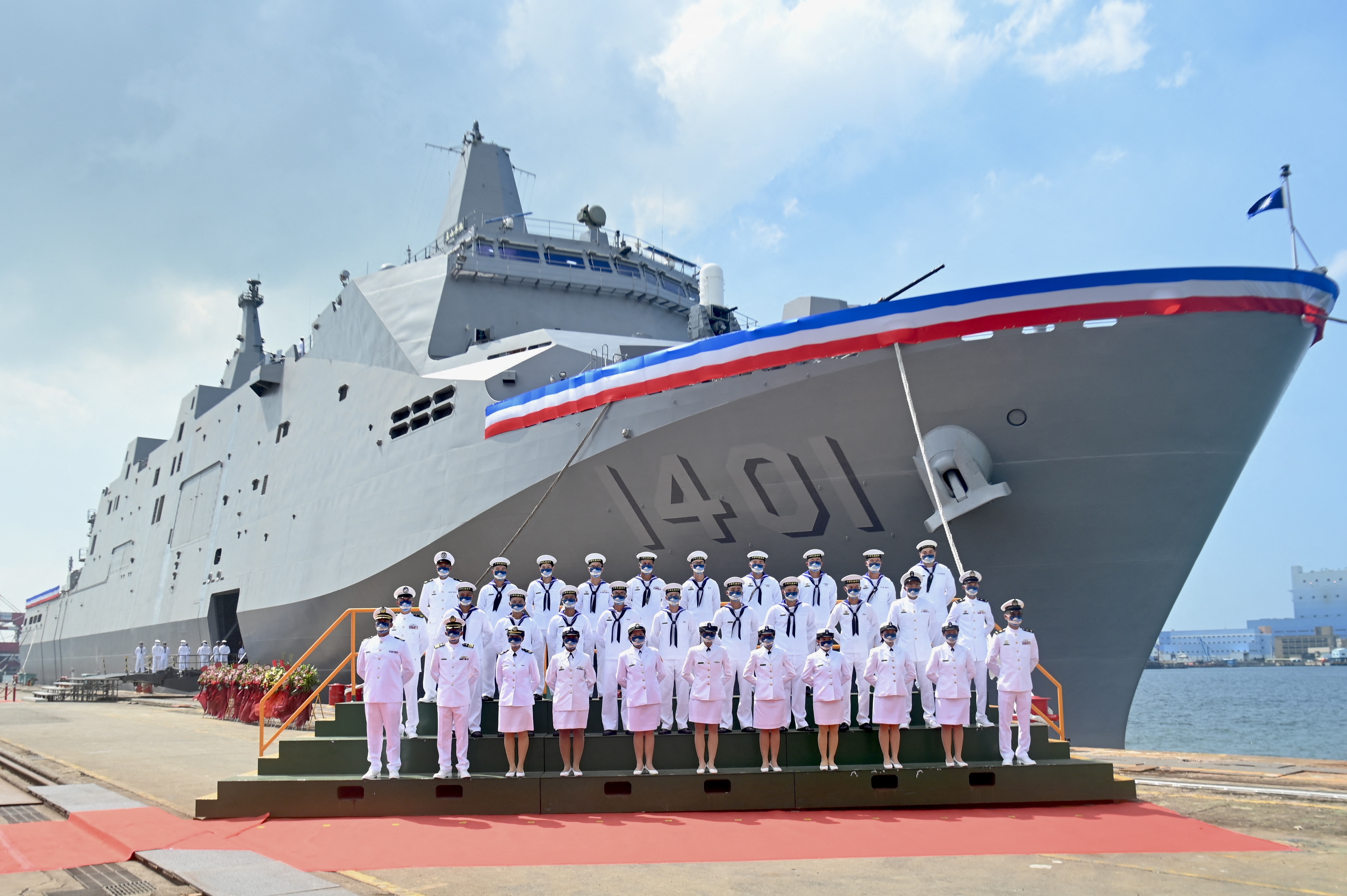 Taiwanese navy soldiers pose for photographs in front of a Yushan-class landing platform dock during a handover ceremony in Kaohsiung on September 30, 2022. (Photo by Sam Yeh / AFP) (Photo by SAM YEH/AFP via Getty Images)