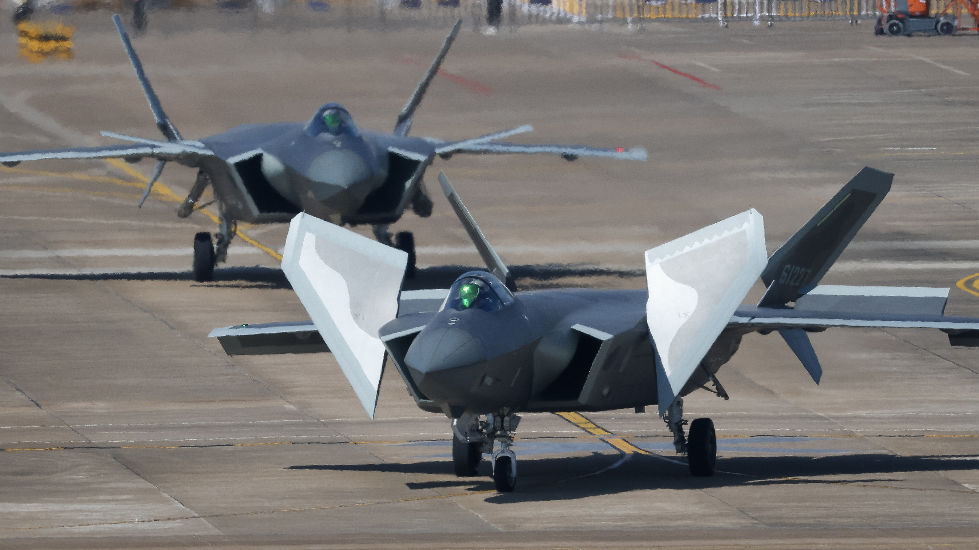 ZHUHAI, CHINA - NOVEMBER 08: J-20 stealth fighters conduct adaptive training for the upcoming 15th China International Aviation and Aerospace Exhibition, or Airshow China 2024, on November 8, 2024 in Zhuhai, Guangdong Province of China. The 15th China International Aviation and Aerospace Exhibition will be held in Zhuhai from November 12 to 17. (Photo by Chen Jimin/China News Service/VCG via Getty Images)