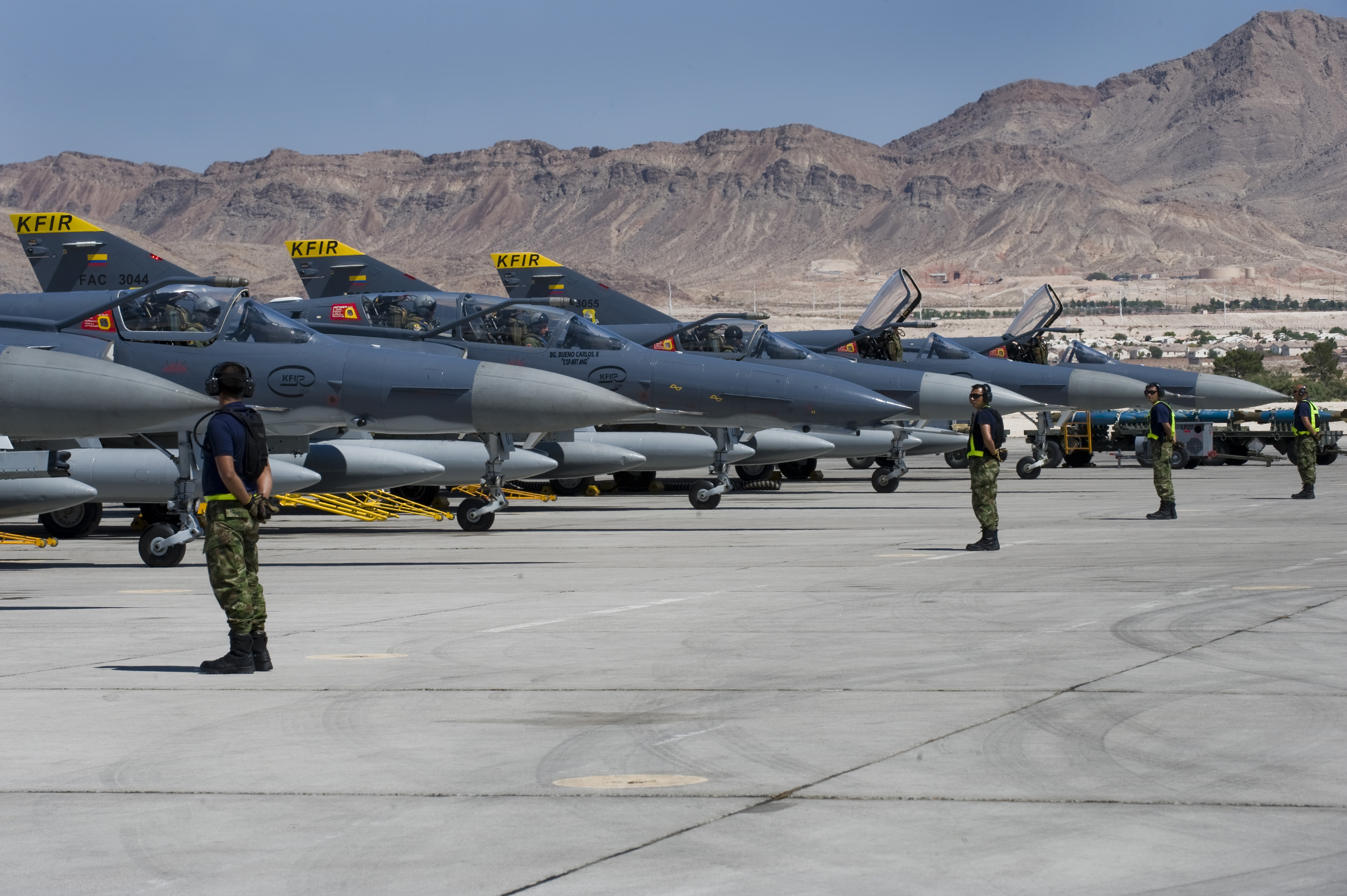 Colombian Air Force Kfir aircraft prepare for a mission during Red Flag 12-4 July 18, 2012, at Nellis Air Force Base, Nev. A U.S. Air Force pilot rides in the backseat of a Kfir on each mission to provide guidance on Nellis specific procedures. (U.S. Air Force photo by Staff Sgt. William P.Coleman)