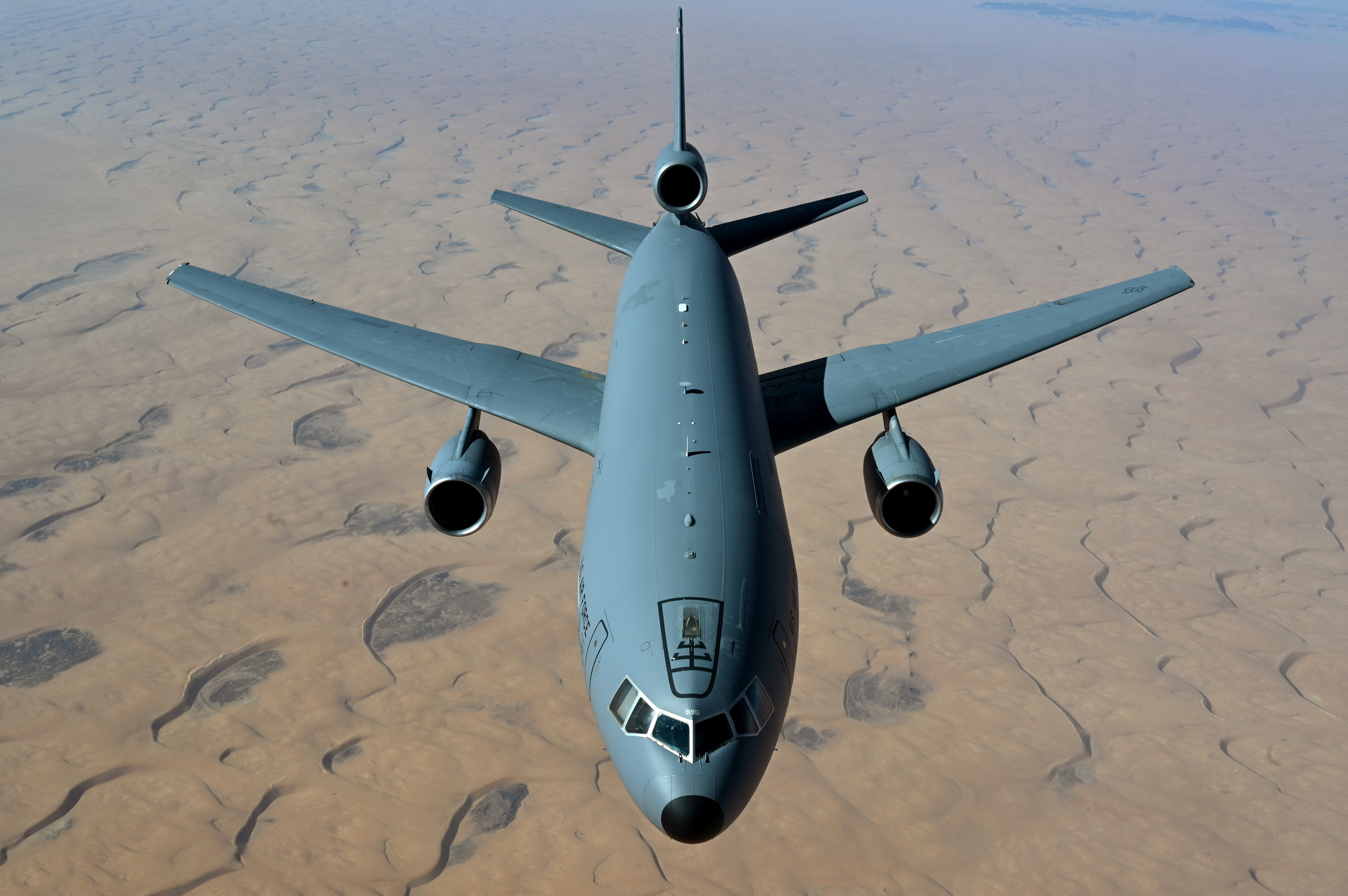 A U.S. Air Force KC-10 Extender assigned to the 908th Expeditionary Air Refueling Squadron, flies over an undisclosed location in the U.S. Central Command area of responsibility, Nov. 10, 2022. The KC-10 delivers global aerial refueling capability to support joint and coalition aircraft, providing war-winning airpower throughout the CENTCOM area of responsibility. (U.S. Air Force photo by Staff Sgt. Gerald R. Willis)