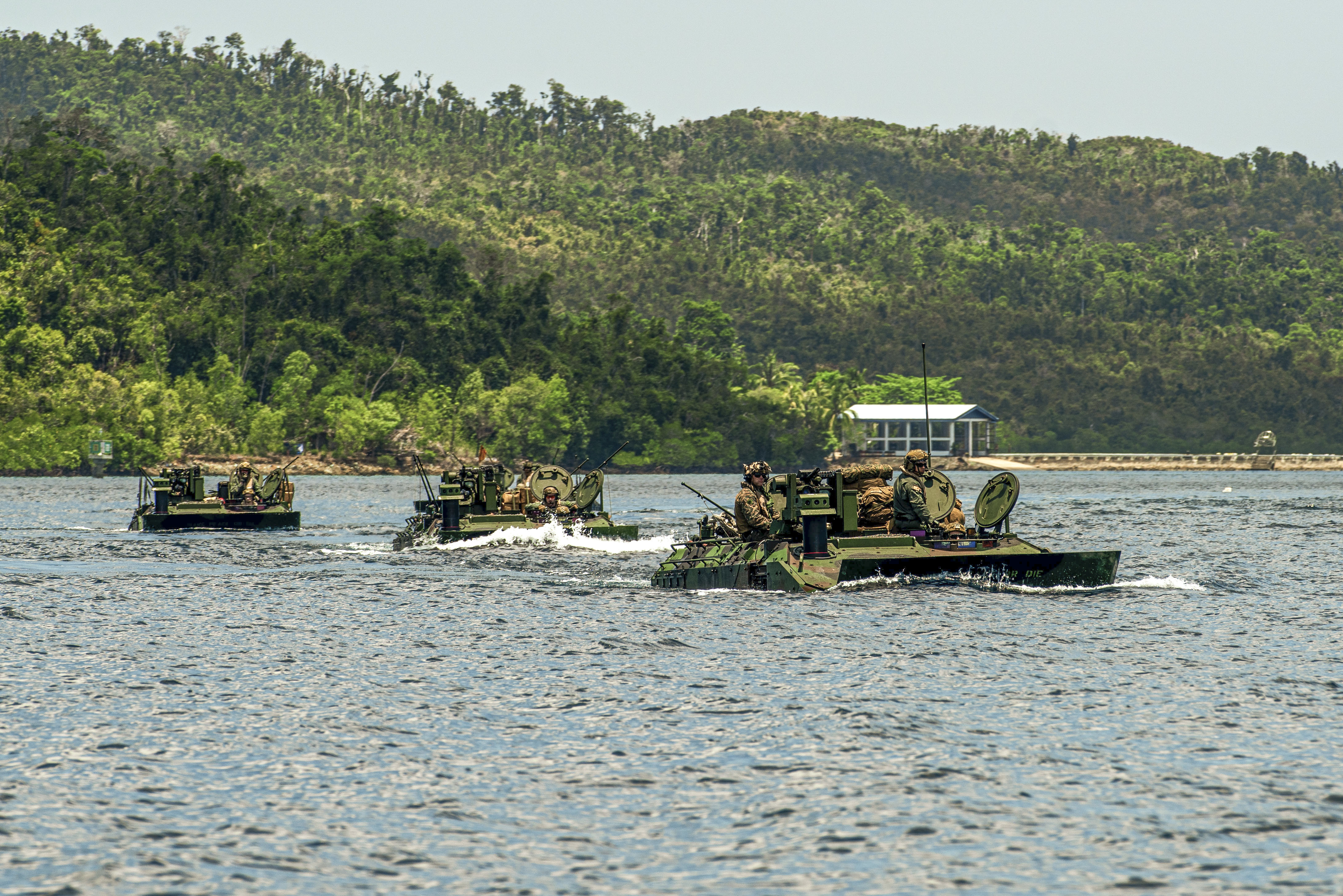 U.S. Marine Corps amphibious combat vehicles attached to Alpha Company, Battalion Landing Team 1/5, 15th Marine Expeditionary Unit, conduct open water transit at Exercise Balikatan 24 in Naval Detachment Oyster Bay, Palawan, Philippines, May 4, 2024. BK 24 is an annual exercise between the Armed Forces of the Philippines and the U.S. military designed to strengthen bilateral interoperability, capabilities, trust, and cooperation built over decades of shared experiences. (U.S. Marine Corps photo by Lance Cpl. Peyton Kahle)