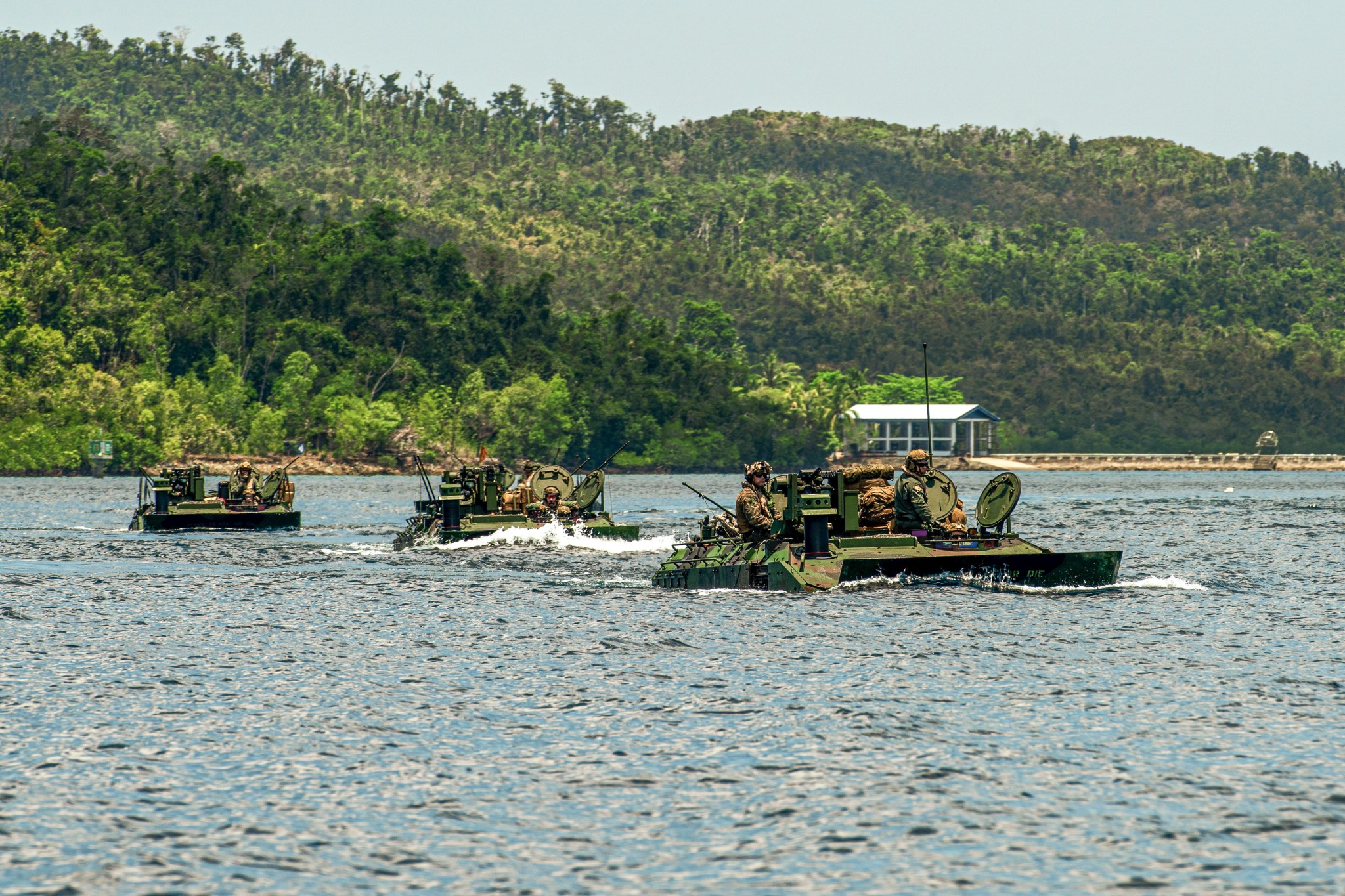 U.S. Marine Corps amphibious combat vehicles attached to Alpha Company, Battalion Landing Team 1/5, 15th Marine Expeditionary Unit, conduct open water transit at Exercise Balikatan 24 in Naval Detachment Oyster Bay, Palawan, Philippines, May 4, 2024. BK 24 is an annual exercise between the Armed Forces of the Philippines and the U.S. military designed to strengthen bilateral interoperability, capabilities, trust, and cooperation built over decades of shared experiences. (U.S. Marine Corps photo by Lance Cpl. Peyton Kahle)