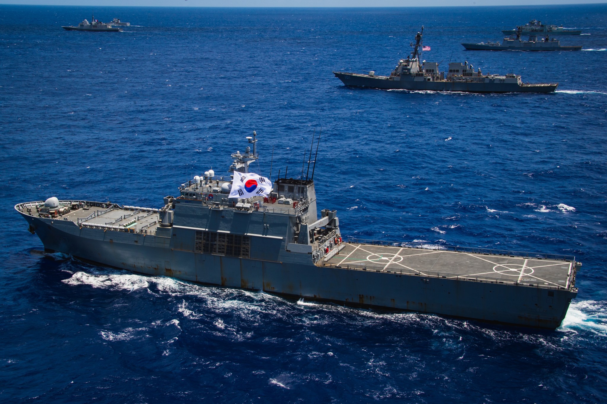 Republic of Korea Navy tank landing ship (LST 687) ROKS Cheon Ja Bong sails in formation during the at-sea phase of Exercise Rim of the Pacific (RIMPAC) 2024. Twenty-nine nations, 40 surface ships, three submarines, 14 national land forces, more than 150 aircraft and 25,000 personnel are participating in RIMPAC in and around the Hawaiian Islands, June 27 to Aug. 1. The world’s largest international maritime exercise, RIMPAC provides a unique training opportunity while fostering and sustaining cooperative relationships among participants critical to ensuring the safety of sea lanes and security on the world’s oceans. RIMPAC 2024 is the 29th exercise in the series that began in 1971. (U.S. Navy photo by Mass Communication Specialist 2nd Class Terrin Hartman)