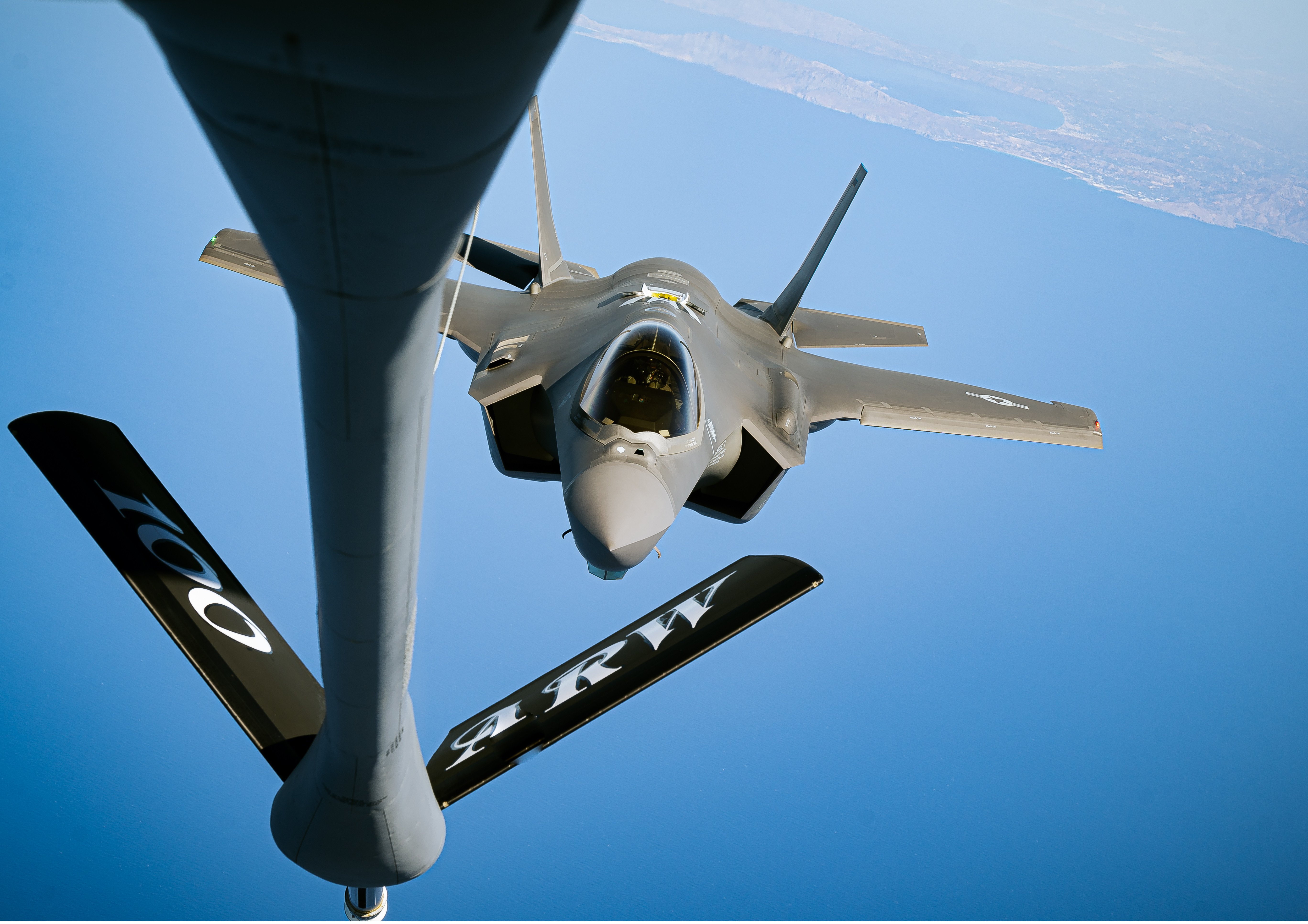 A U.S. Air Force KC-135 Stratotanker aircraft, assigned to the 100th Air Refueling Wing, refuels a U.S. Air Force F-35A Lightning II aircraft during exercise RAMSTEIN FLAG 2024 while flying over the coast of Greece, Oct. 4, 2024. RAFL24 demonstrates NATO unity and strength, as Allies across the Euro-Atlantic area train side by side in defensive and offensive air operations scenarios in support of the enduring commitment to shared values and ability to adapt to the emerging environment. (U.S. Air Force photo by Senior Airman Edgar Grimaldo)