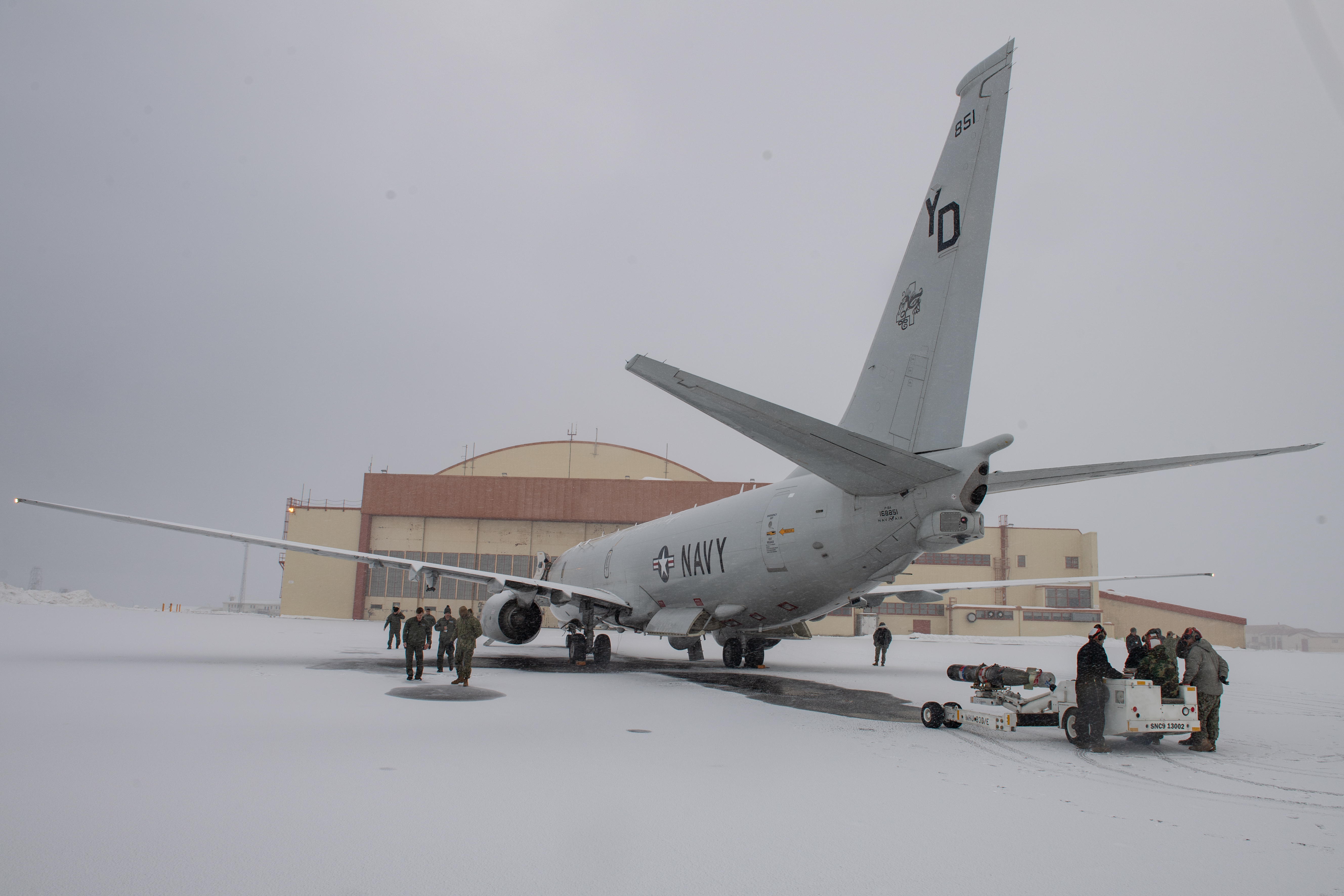 200302-N-AZ907-0115 KEFLAVIK, Iceland (March 2, 2020) -- Personnel, assigned to Patrol Squadron 4 (VP-4), use a munitions handling unit to transport a torpedo to a P-8 Poseidon, during an explosive ordnance exercise (EXPORD 20-1) led by Navy Expeditionary Combat Force Europe-Africa/Task Force (CTF) 68, March 2, 2020. CTF 68 provides explosive ordnance disposal operations, naval construction, expeditionary security, and theater security efforts in the U.S. 6th Fleet area of responsibility. (U.S. Navy photo by Mass Communication Specialist 1st Class Peter Lewis/Released)