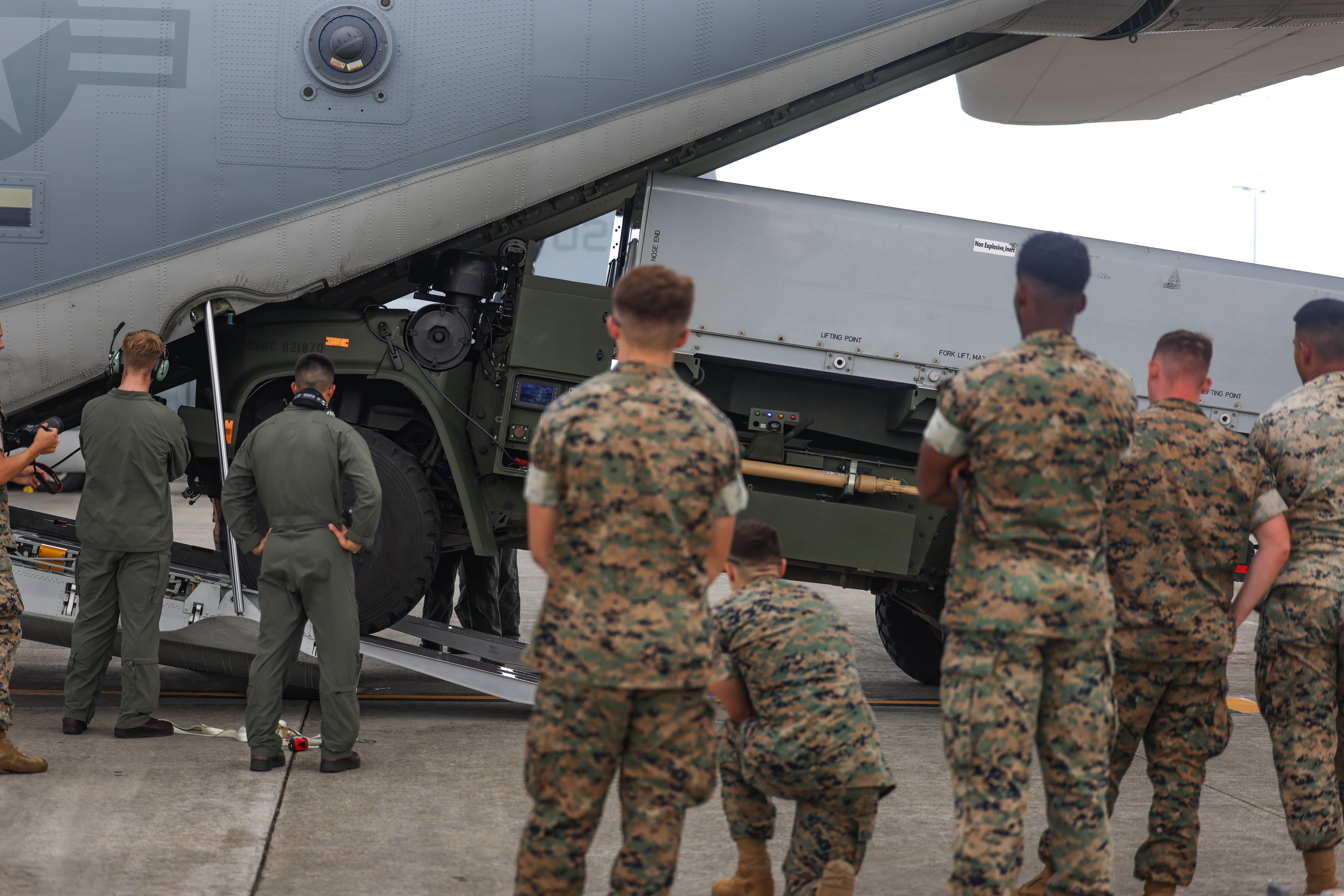 U.S. Marines with 3d Littoral Combat Team, 3d Marine Littoral Regiment, 3d Marine Division, load a Navy-Marine Expeditionary Ship Interdiction System onto a KC-130J Super Hercules during aerial transport operations on Marine Corps Base Hawaii, Nov. 5, 2024. Aerial transport operations allow Marines to rapidly deploy and relocate the NMESIS to remote locations, enhancing flexibility and responsiveness in contested areas. (U.S. Marine Corps photo by Sgt. Grace Gerlach)
