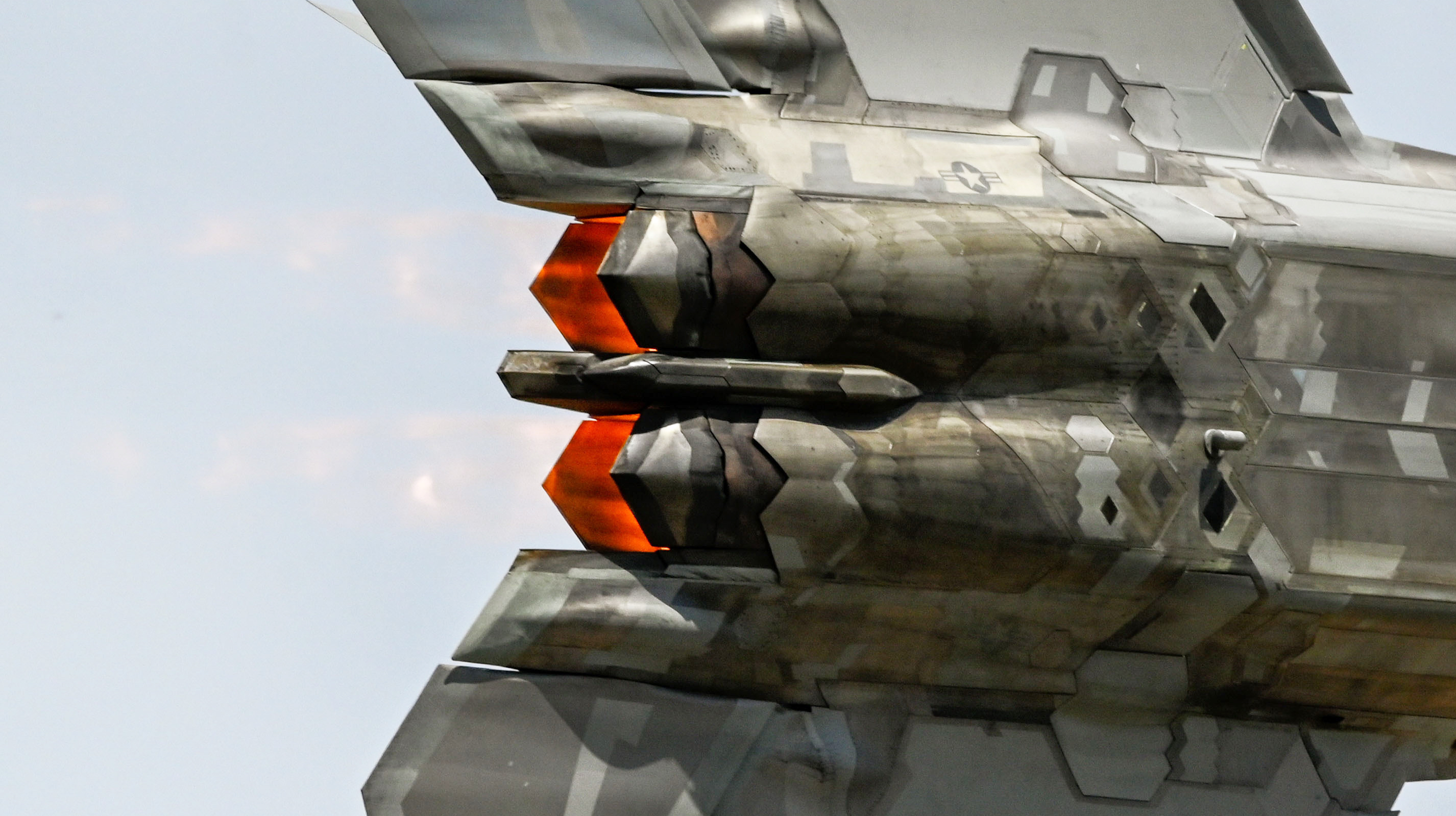 A U.S. Air Force F-22 Raptor aircraft assigned to the F-22 Demonstration Team soars overhead with afterburners lit during a performance at the Altus Airpower Stampede Open House and Air Show at Altus Air Force Base, Oklahoma, April 13, 2025. The demonstration showcased the Raptor’s unmatched thrust and maneuverability. (U.S. Air Force photo by Airman 1st Class Jonah Bliss)