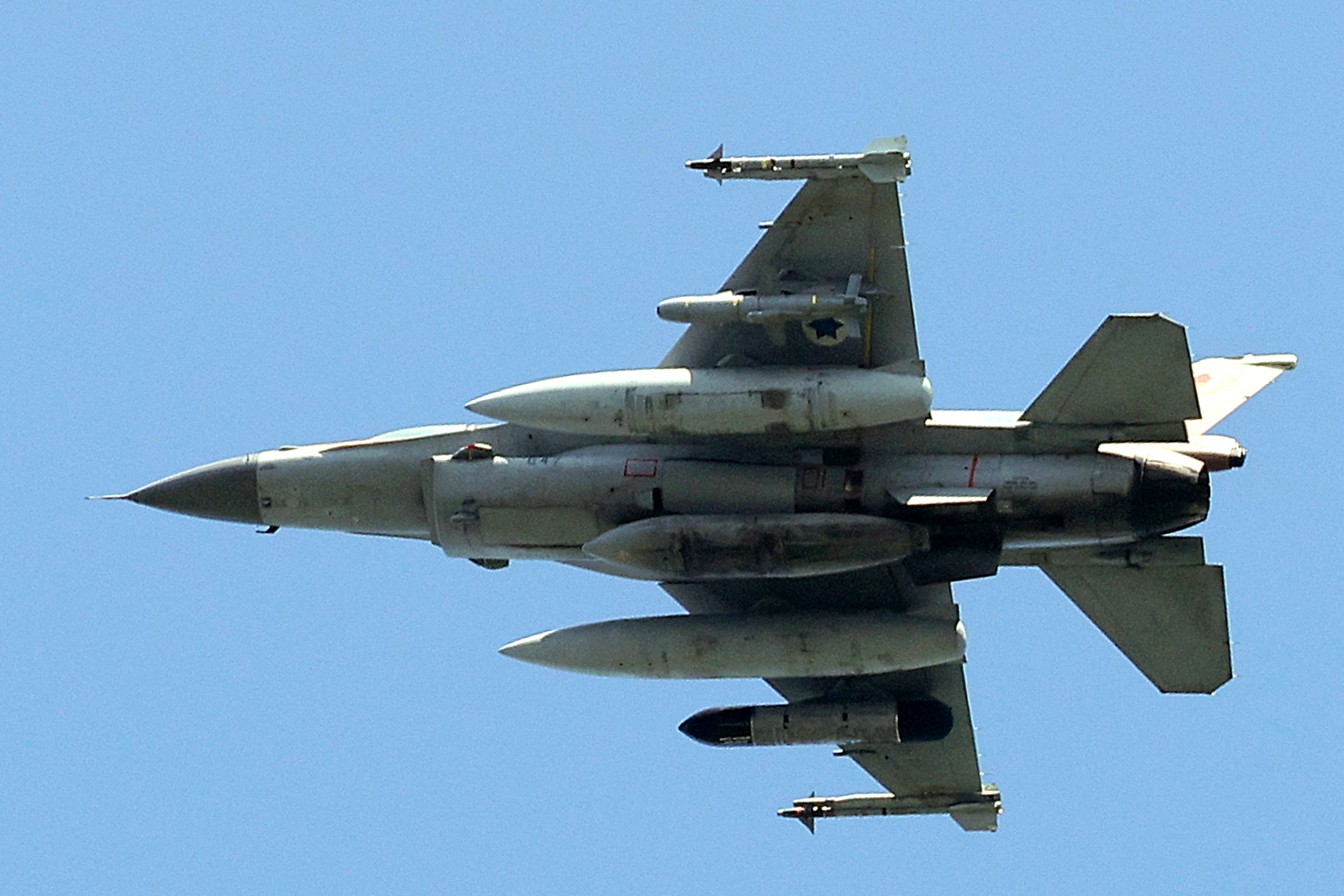 TOPSHOT - An Israeli Air Force F-16 fighter aircraft flies over the city of Yokneam Illit in northern Israel on March 24, 2025. (Photo by JACK GUEZ / AFP) (Photo by JACK GUEZ/AFP via Getty Images)