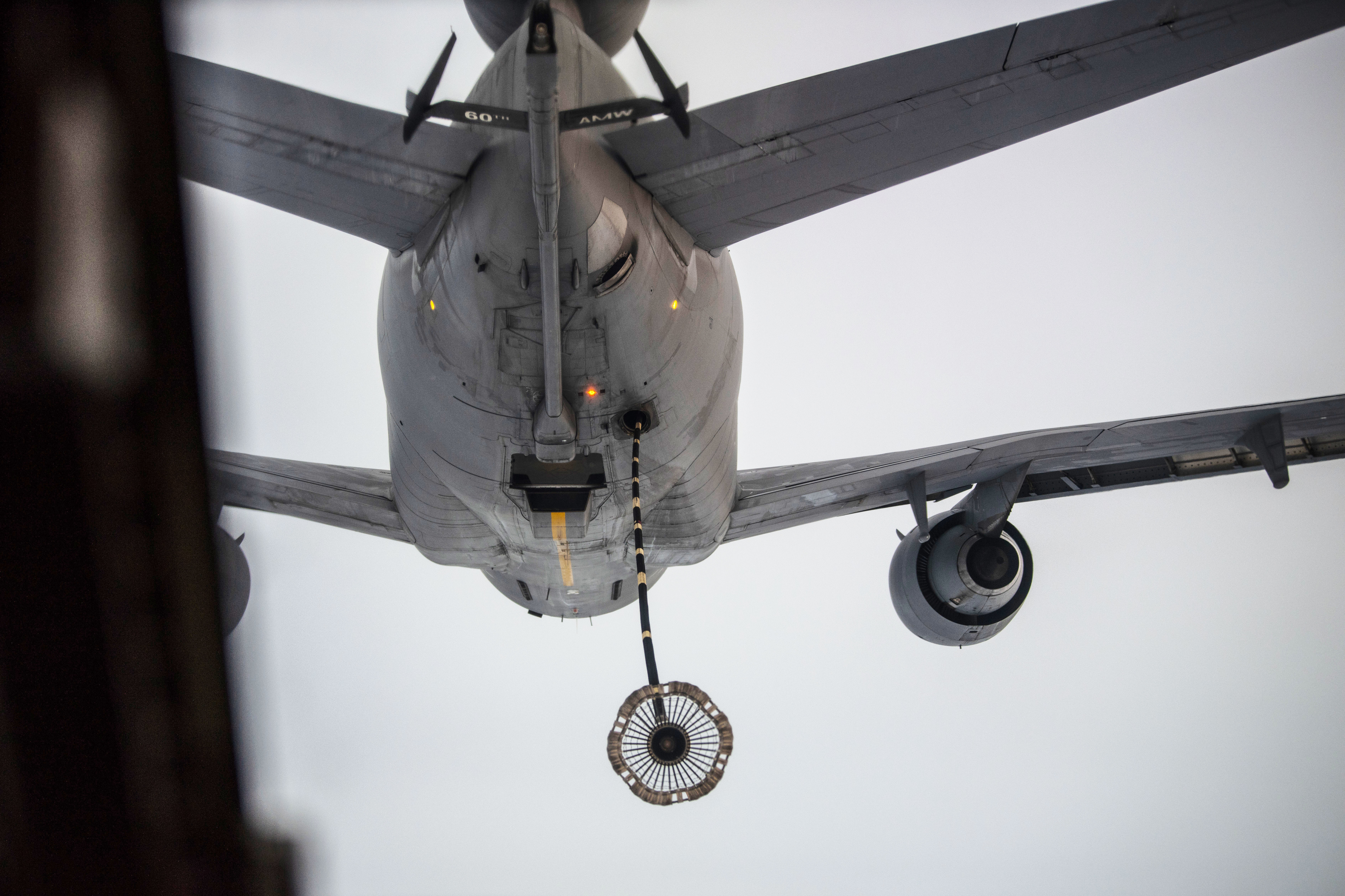 A KC-10 Extender, assigned to the 6th Air Refueling Squadron at Travis Air Force Base, Calif., reaches its aerial refueling hose and drogue basket toward a CV-22 Osprey aircraft, assigned to the 20th Special Operations Squadron, during a Tactical Air-Refueling mission March 11, 2019, over the Southwest region of the U.S. Aerial refueling allows the receiving aircraft to prolong its time airborne and has also been considered to reduced fuel consumption on long-distance flights. (U.S. Air Force photo by Staff Sgt. Luke Kitterman)