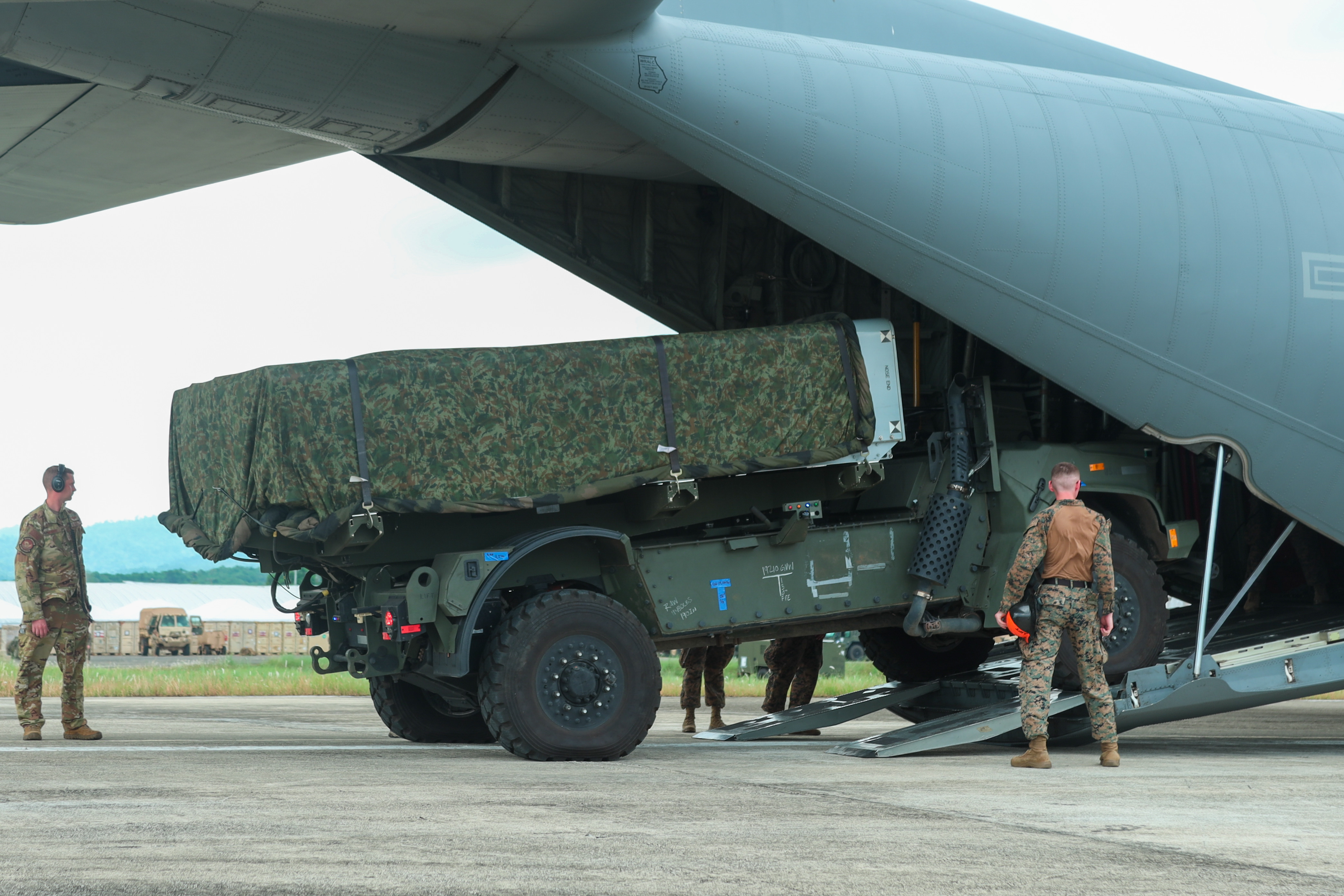 U.S. Marines with Medium-Range Missile Battery, 3d Littoral Combat Team, 3d Marine Littoral Regiment, 3d Marine Division load a Navy-Marine Expeditionary Ship Interdiction System onto a U.S. Air Force C-130J Super Hercules assigned to 39th Airlift Squadron during Exercise Balikatan 25 at Lal-lo, Philippines, April 26, 2025. This marks the inaugural deployment of the newly fielded Marine Corps weapon system to the Philippines and serves as a major milestone for the continuously developing U.S.-Philippines Alliance. Balikatan is a longstanding annual exercise between the Armed Forces of the Philippines and U.S. military designed to strengthen our ironclad alliance, improve our capable combined force, and demonstrate our commitment to regional security and stability. (U.S. Marine Corps photo by LCpl Maksim Masloboev)