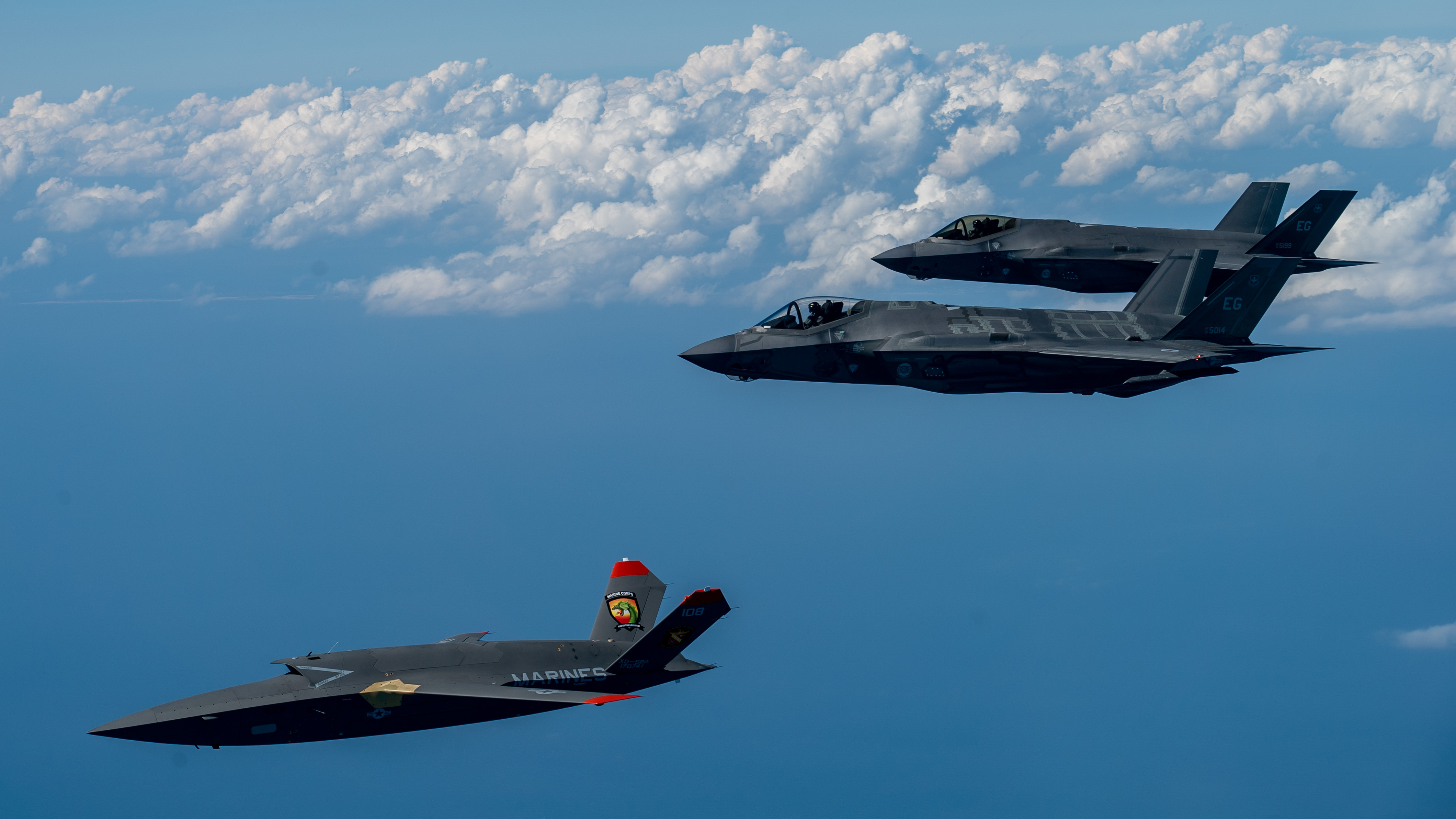 A U.S. Marine Corps XQ-58A Valkyrie, highly autonomous, low-cost tactical unmanned air vehicle, conducts its second test flight with two U.S. Air Force F-35A Lightning II aircraft assigned to 33rd Fighter Wing, 96th Test Wing at Eglin Air Force Base, Fla., Feb. 23, 2023. The XQ-58A Valkyrie test flight and the data collected inform future requirements for the Marine Corps in a rapidly evolving security environment, while successfully fueling joint innovation and experimentation opportunities. (U.S. Air Force photo by Master Sgt. John McRell)