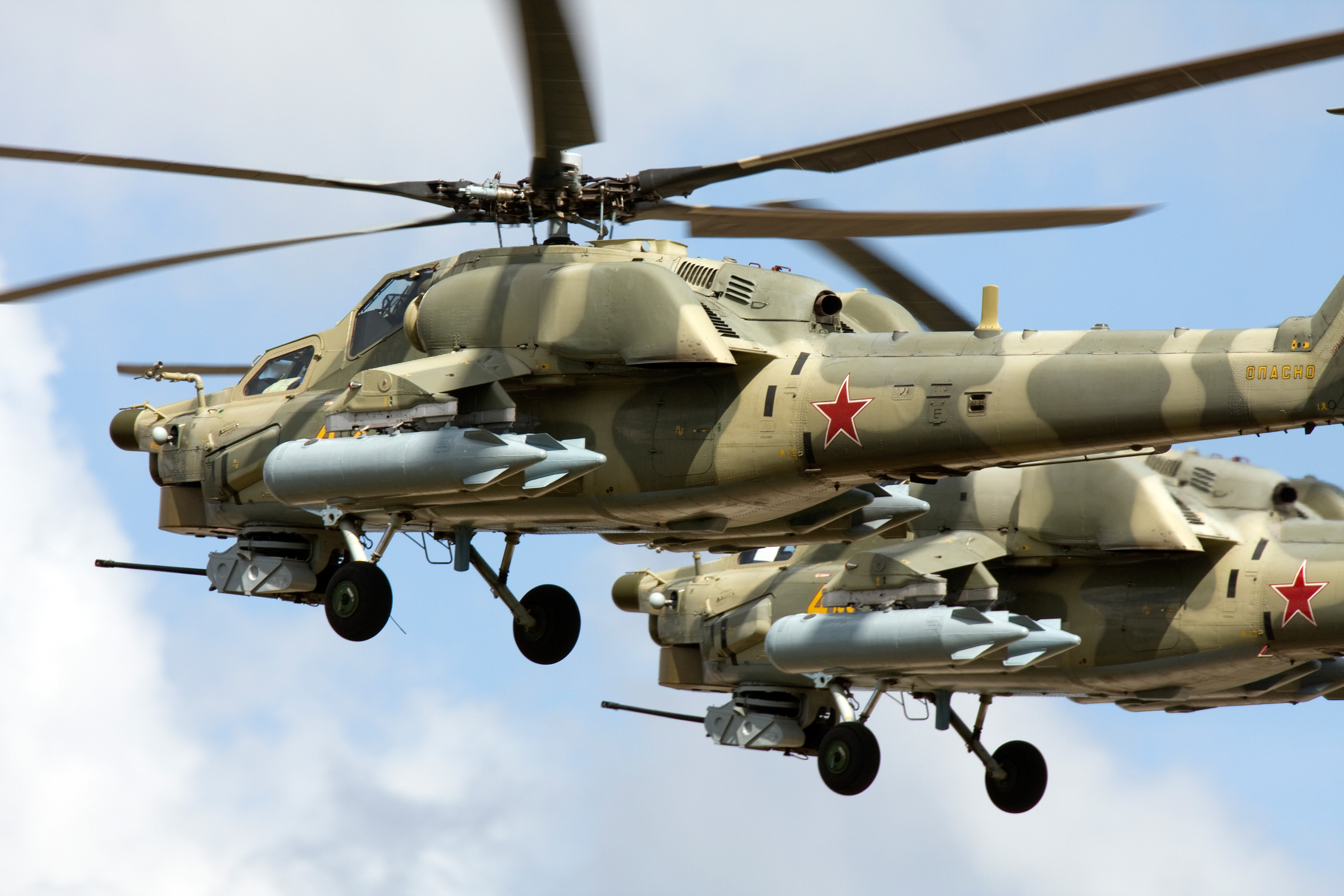 Two Mil Mi-28 all-weather, day-night, military tandem, two-seat anti-armor attack helicopters of Russian Air Force fly in formation at the MAKS airshow near Moscow, Russia. (Photo by: aviation-images.com/Universal Images Group via Getty Images)