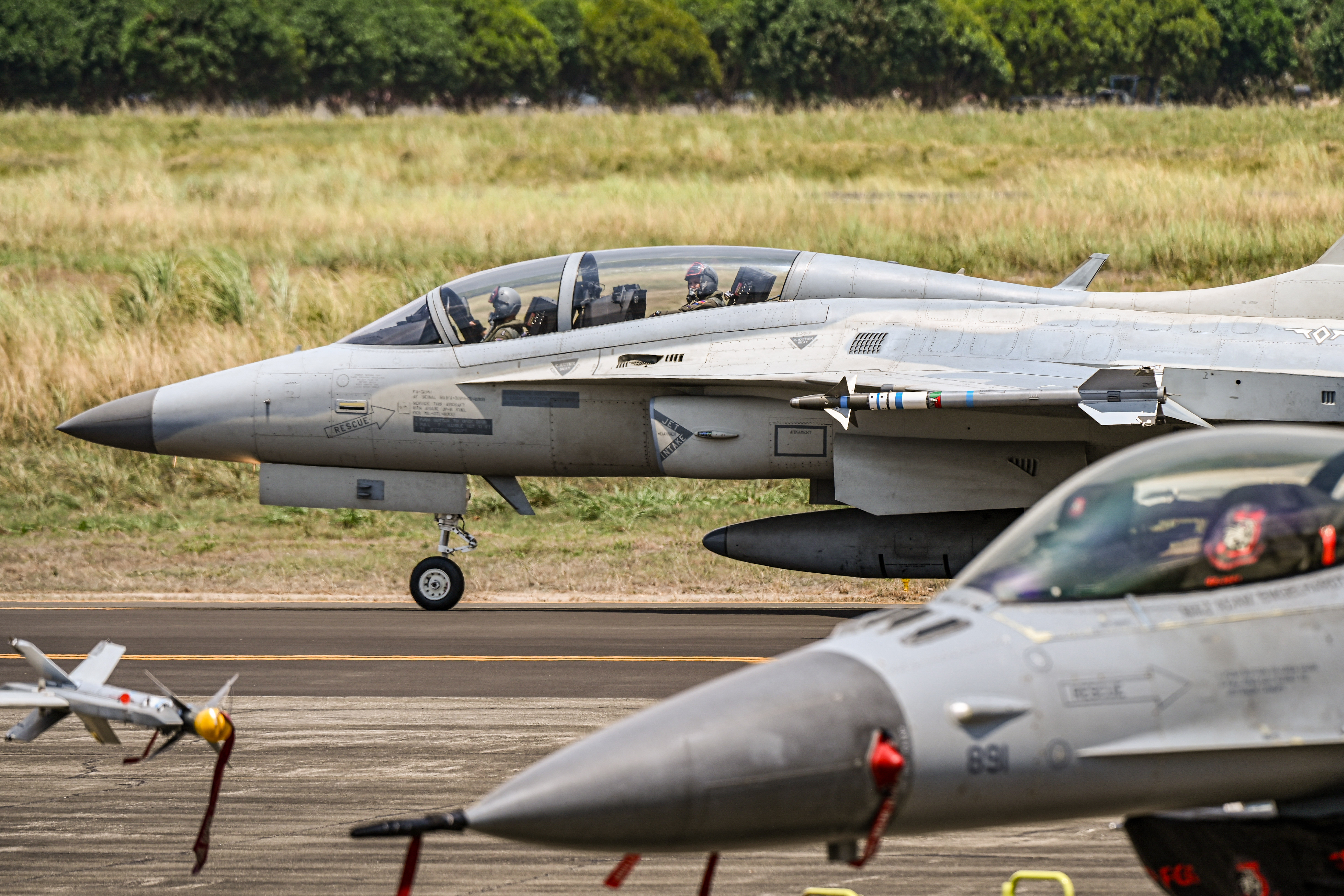 Philippine Air Force pilots onboard a Philippine Air Force FA-50 land during the US-Philippines joint air force military exercise dubbed 'Cope Thunder' at Basa Air Base in Pampanga on April 11, 2024. (Photo by JAM STA ROSA / AFP) (Photo by JAM STA ROSA/AFP via Getty Images)