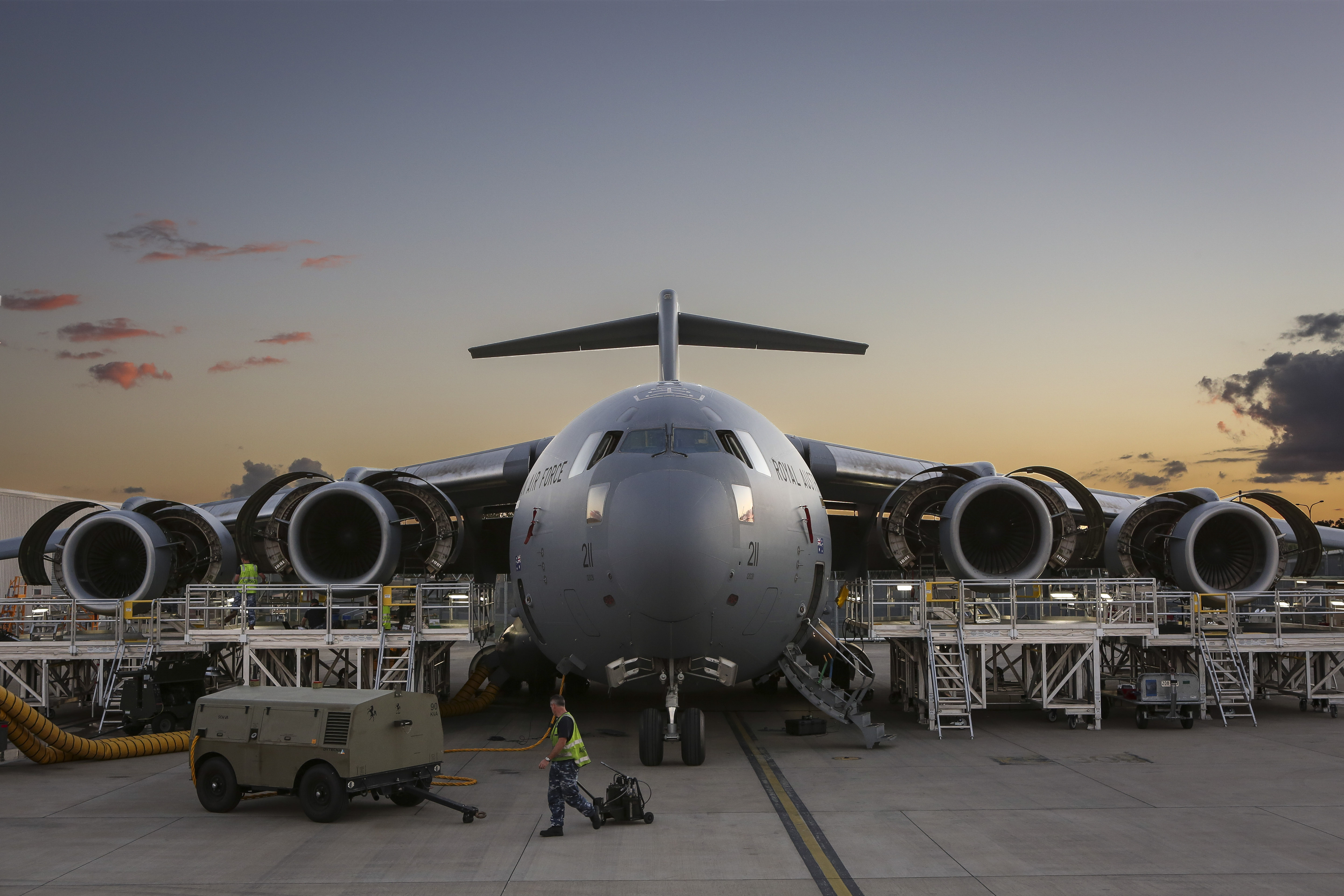 Air Force C-17 Globemaster with engine maintenance stands in place and all engines open on sunset at No. 36 Squadron, RAAF Base Amberley. *** Local Caption *** Newly constructed engine maintenance stands are used specifically for the C-17's major inspection service known as the Home Station Check or 'HSC'. The stands were built to increase efficiencies, create easier access and increase safety.