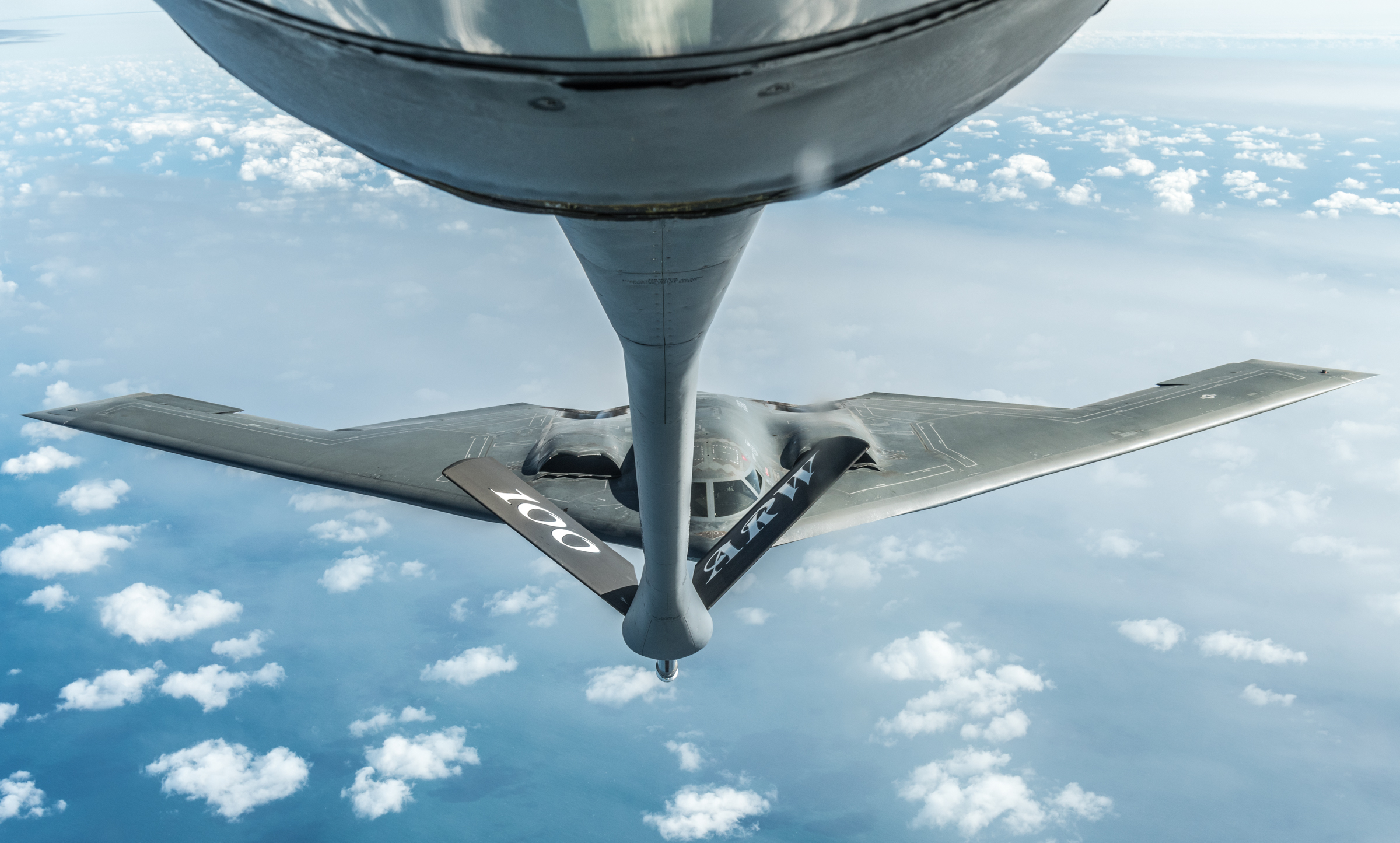 A B-2 Stealth Bomber, assigned to the 509th Bomb Wing at Whiteman Air Force Base, Missouri, flies flies behind a KC-135 Stratotanker assigned to RAF Mildenhall, England, during a training mission for Bomber Task Force Europe on September 16, 2019. During this training mission two Royal Air Force F-35 Lightning IIs assigned to RAF Marham, England also flew in formation with two F-15 Eagles assigned to the 48th Fighter Wing, RAF Lakenheath, England and two B-2 Spirit Stealth Bombers assigned to the 509th Bomb Wing, Whiteman Air Force Base, Missouri. Bomber missions like BTF Europe, help familiarize aircrews with air bases, airspace and operations in different geographic combatant commands. These multinational missions strengthen professional relationships and improves overall coordination with allies and partner militaries. (U.S. Air Force photo by Senior Airman Thomas Barley)