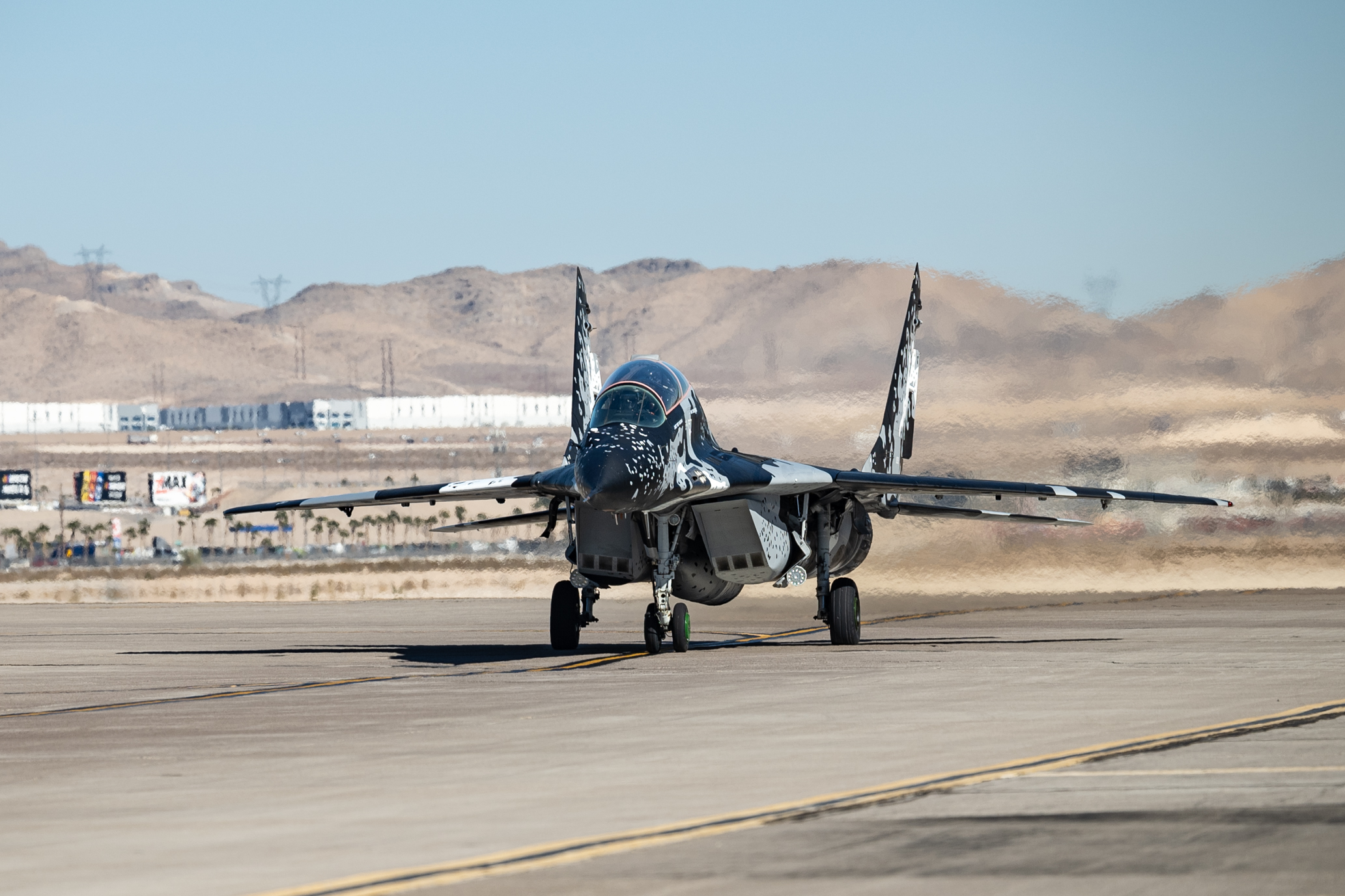 A MiG-29 taxis prior to take off to participate in a memorial flyover for Retired U.S. Air Force Col. Gail Peck at Nellis Air Force Base, Nevada, Nov. 7, 2024. Col. Peck was the first commanding officer of the 4477th TES Red Eagles, a unit that helped rejuvenate air-to-air combat tactics, and helped change dogfighting tactics that played a significant part in the Air Force’s Red Flag program and the US Navy’s Instructor program, more popularly known as TOPGUN. (U.S. Air Force photo by William R. Lewis)