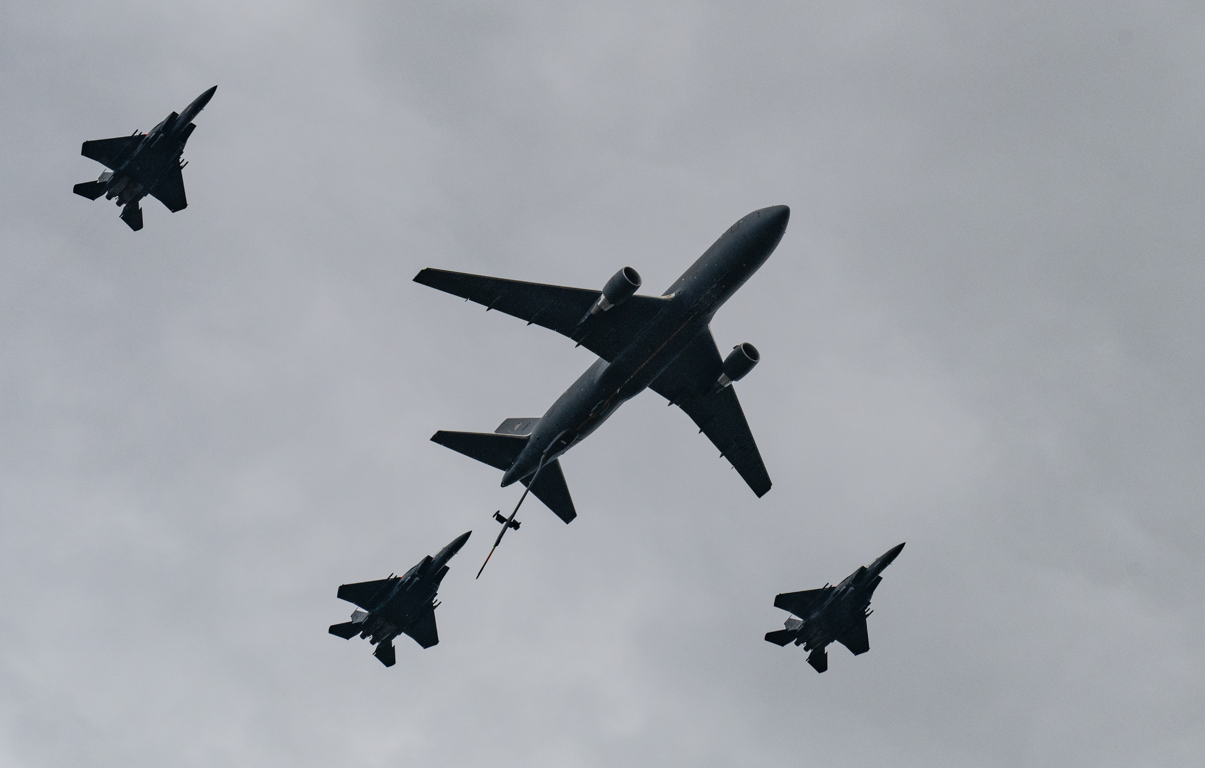 Three F-15 Strike Eagles and a KC-46 Pegasus fly in formation as part of the opening ceremony during Wings Over Wayne Open House 2025 at Seymour Johnson Air Force Base, North Carolina, May 4, 2025. The event helped unite the community and inspire future generations with the Air Force’s aviation capabilities. (U.S. Air Force photo by Master Sgt. Alexandre Montes)