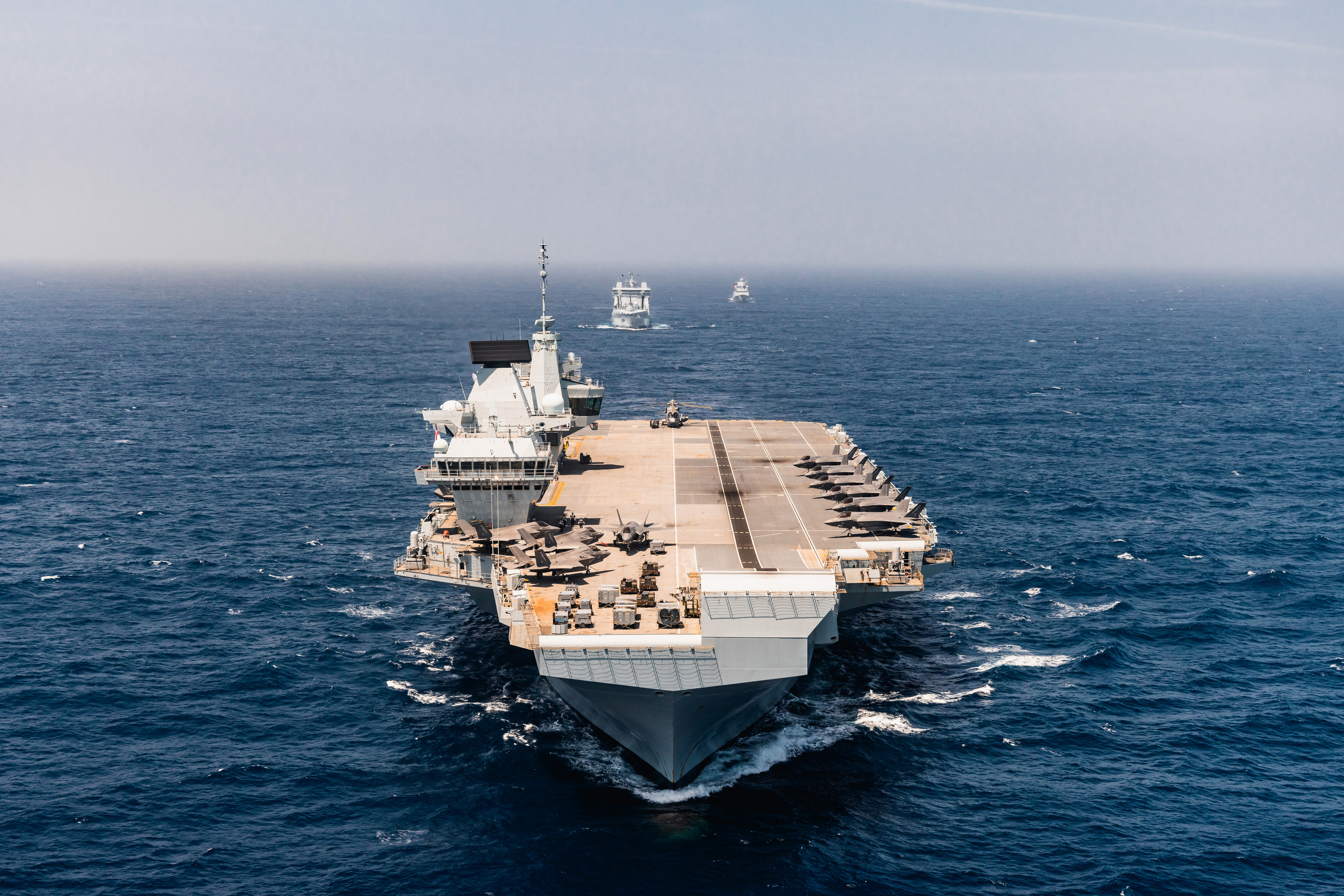 Pictured: HMS Prince of Wales. RFA Tide Force followed by HNoMS Roal Amundsen in the distance. Aerial imagery HMS Prince of Wales sailing with the UK CSG25 Op Highmast Task Group taken from a Wildcat of 815 Naval Air Squadron. RFA Tide Force followed by HNoMS Roal Amundsen in the distance. The Carrier Strike Group is the Royal Navy's key deployment of 2025. Led by UK flagship HMS Prince of Wales and involving a dozen nations, the eight-month mission - known as Operation Highmast - will take the task group to the western Pacific Rim via the Mediterranean and Middle East with a series of large-scale exercises with Britain's allies and partners. The goal is to reaffirm the UK’s commitment to the security of the Mediterranean and Indo-Pacific region, demonstrate collective resolve with our allies and showcase British trade and industry. Over the course of the deployment, upwards of 4,500 British military personnel will be involved, including nearly 600 RAF and 900 soldiers alongside 2,500 Royal Navy sai