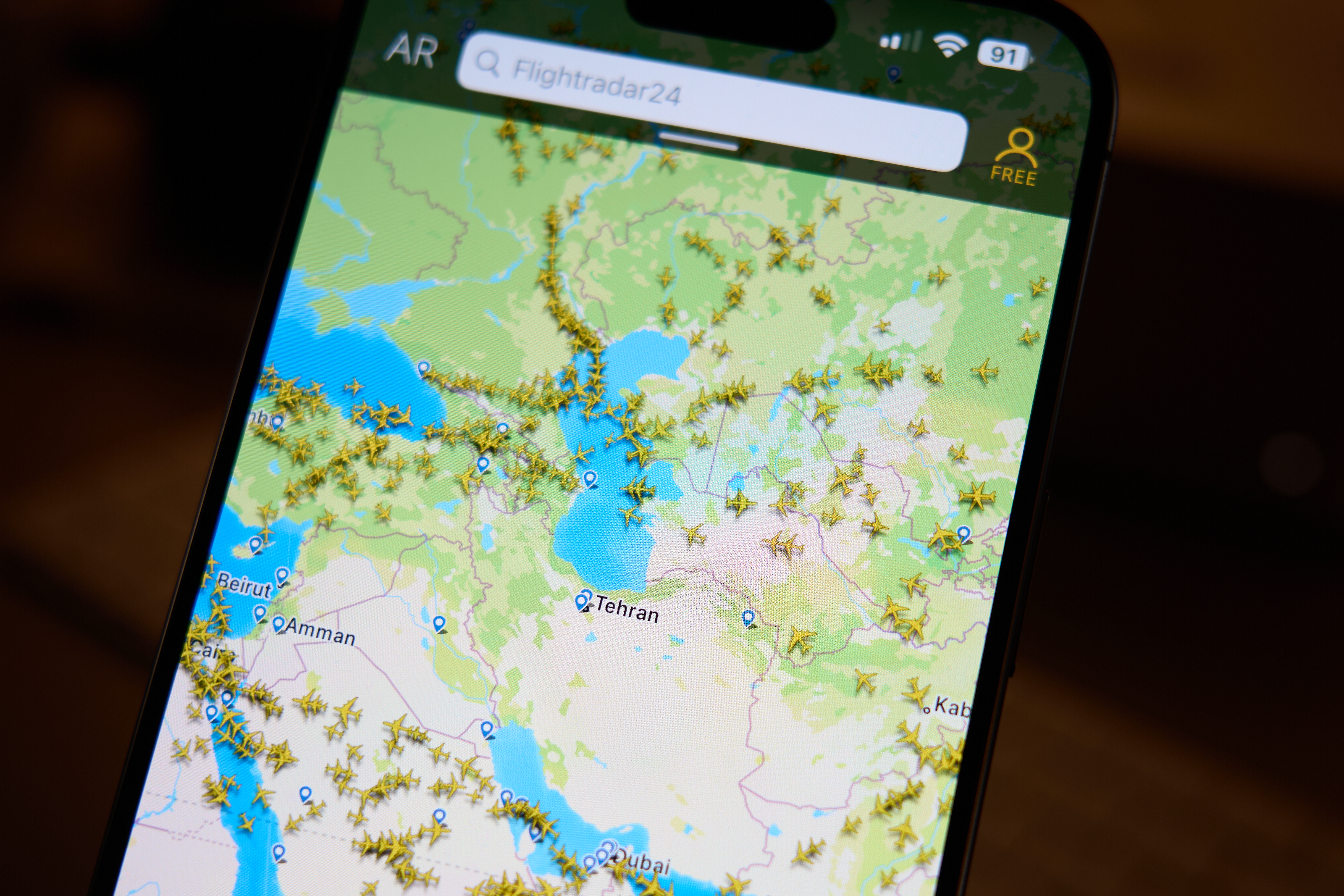 A gap is seen in the airspace over Iran on the Flightradar24 app in this illustration photo taken in Warsaw, Poland on 13 June, 2025. (Photo by Jaap Arriens/NurPhoto via Getty Images)