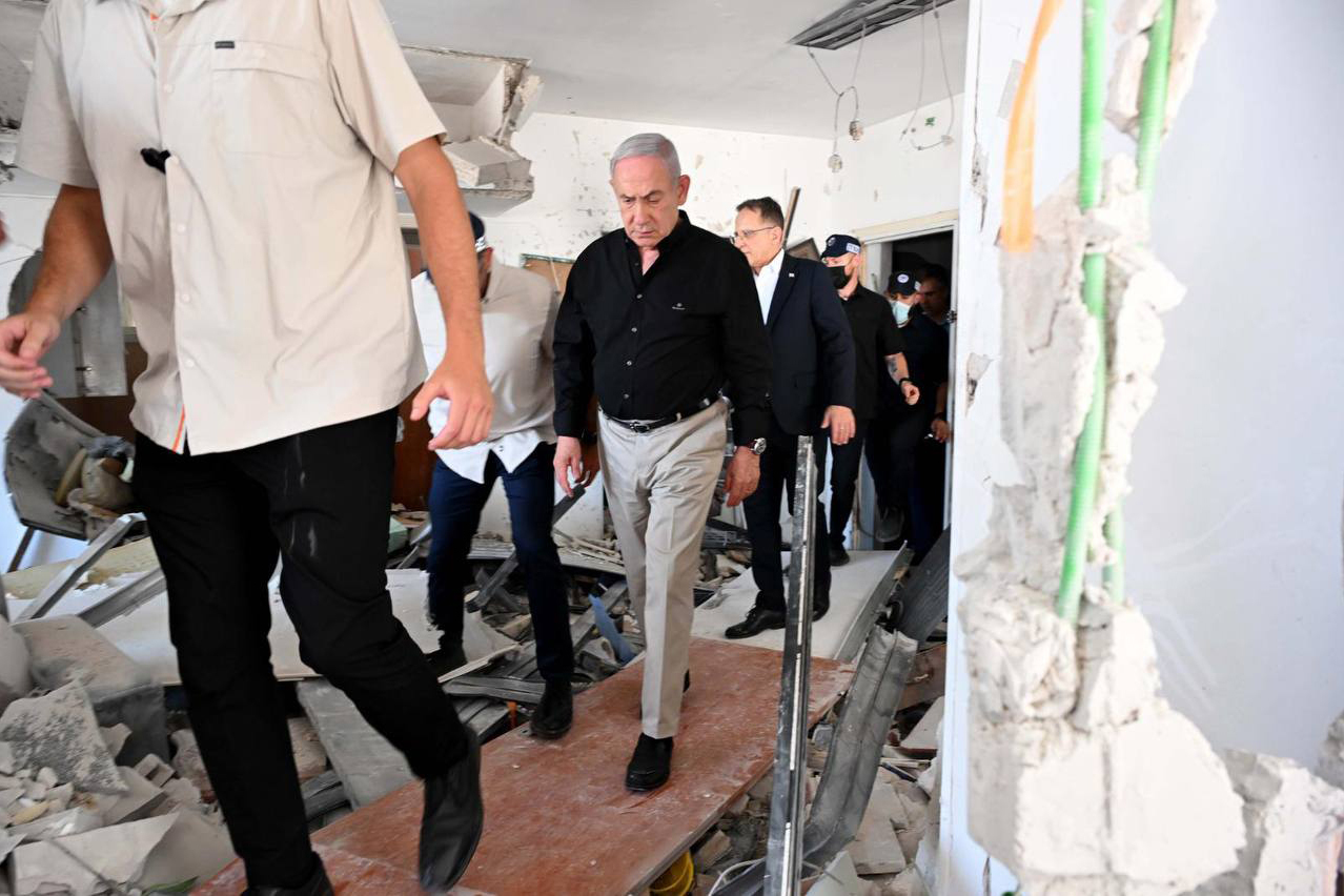 BAT YAM, ISRAEL JUNE 15: (----EDITORIAL USE ONLY MANDATORY CREDIT - 'AVI OHAYON / GPO / HANDOUT' - NO MARKETING NO ADVERTISING CAMPAIGNS - DISTRIBUTED AS A SERVICE TO CLIENTS----) Israeli Prime Minister Benjamin Netanyahu inspects demolished apartment buildings following Iran's launch of a ballistic missile attack against Israel in Bat Yam on June 15, 2025. (Photo by Avi Ohayon (GPO) / Handout/Anadolu via Getty Images)