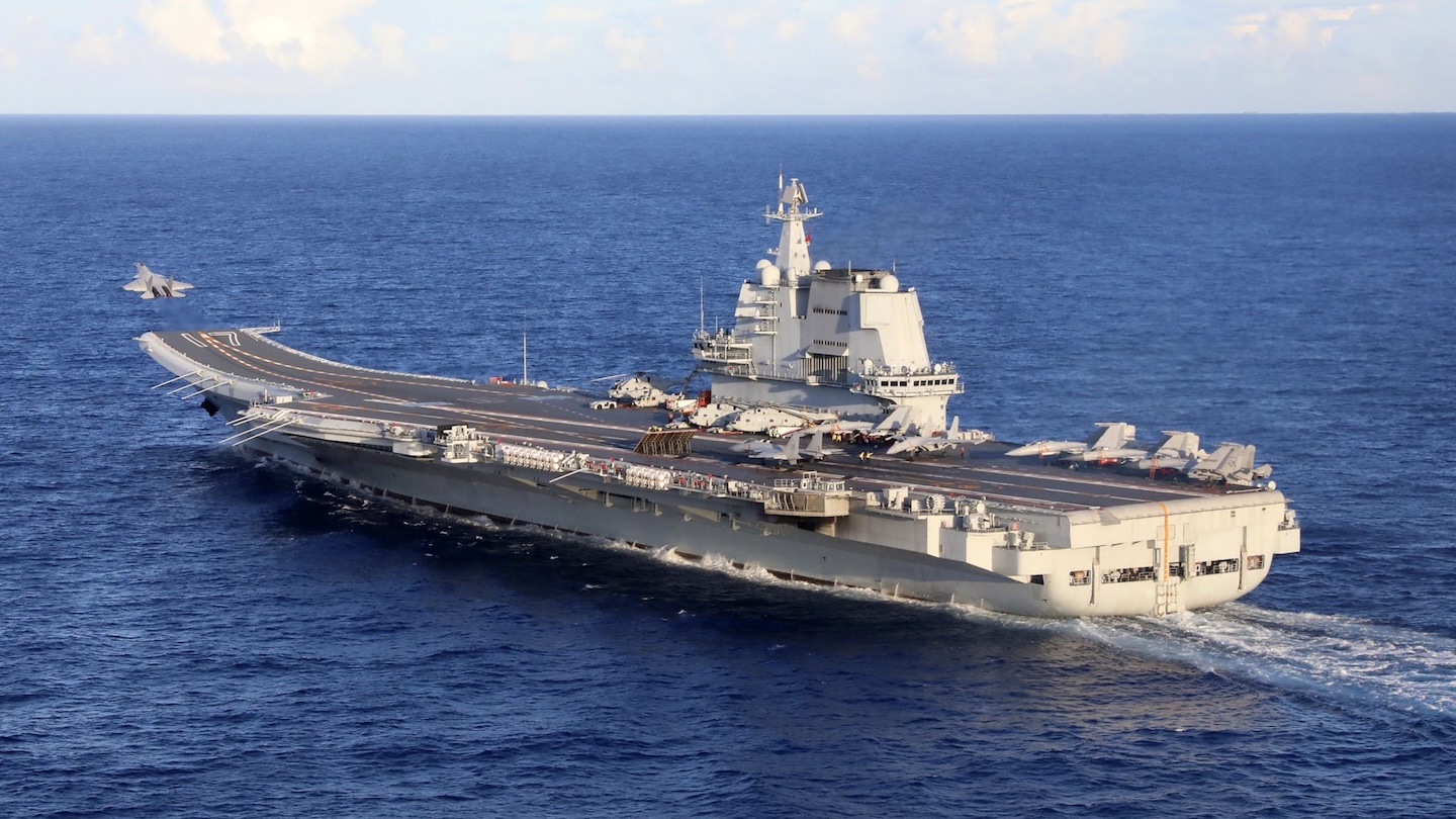 The Chinese People’s Liberation Army Navy (PLAN) has released photos showing two of its aircraft carriers operating simultaneously for the first time beyond the so-called First Island Chain in the western Pacific.
