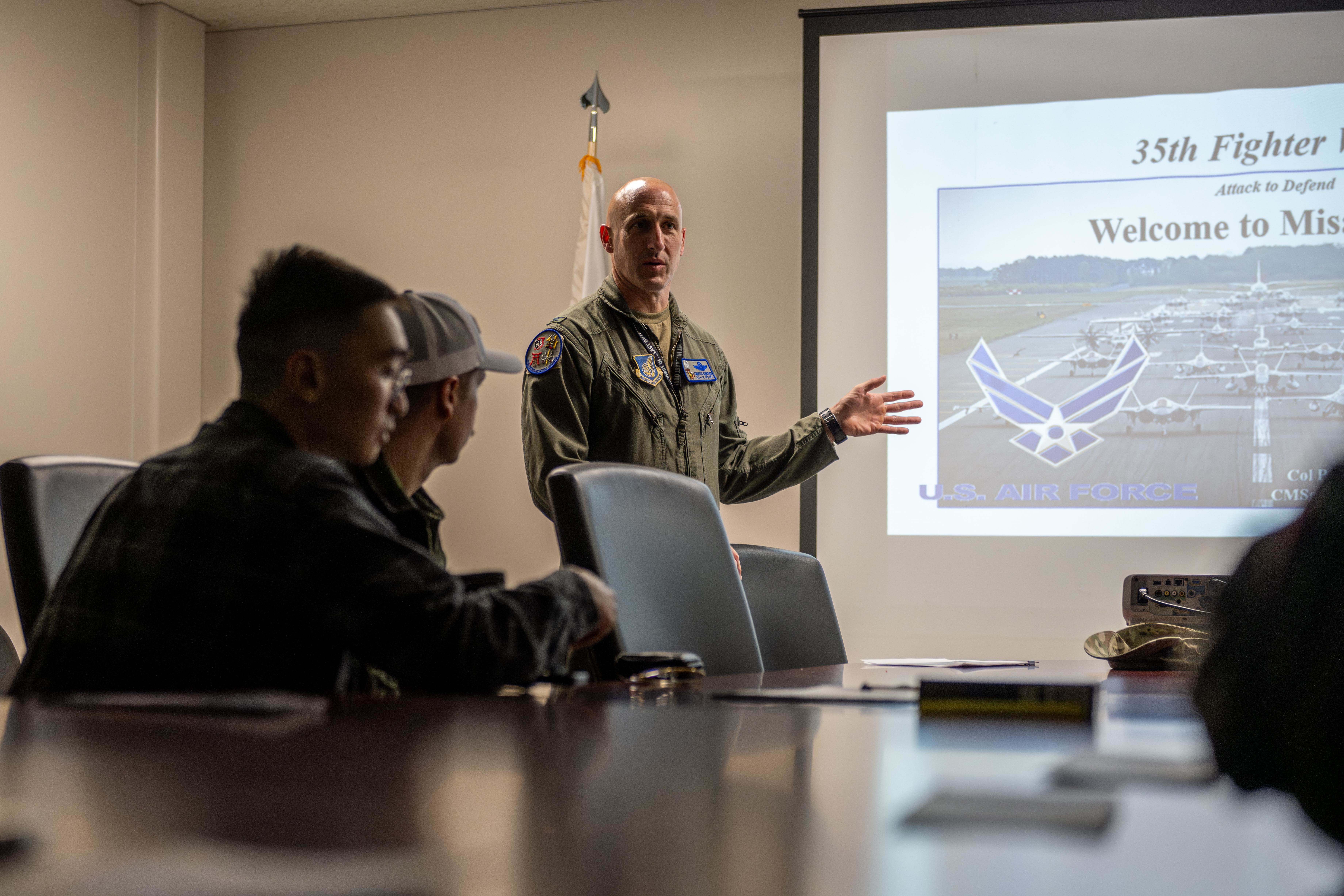 U.S. Air Force Col. Jeromy Guinther, 35th Operations Group commander, briefs incoming exercise Resolute Force Pacific (REFORPAC) 2025 temporary duty members at Misawa Air Base, Japan, July 9, 2025. REFORPAC enables Airmen to operate alongside joint and allied partners, enhancing collective contingency response and boosting interoperability across all domains. (U.S. Air Force photo by Airman Hannah Bench)