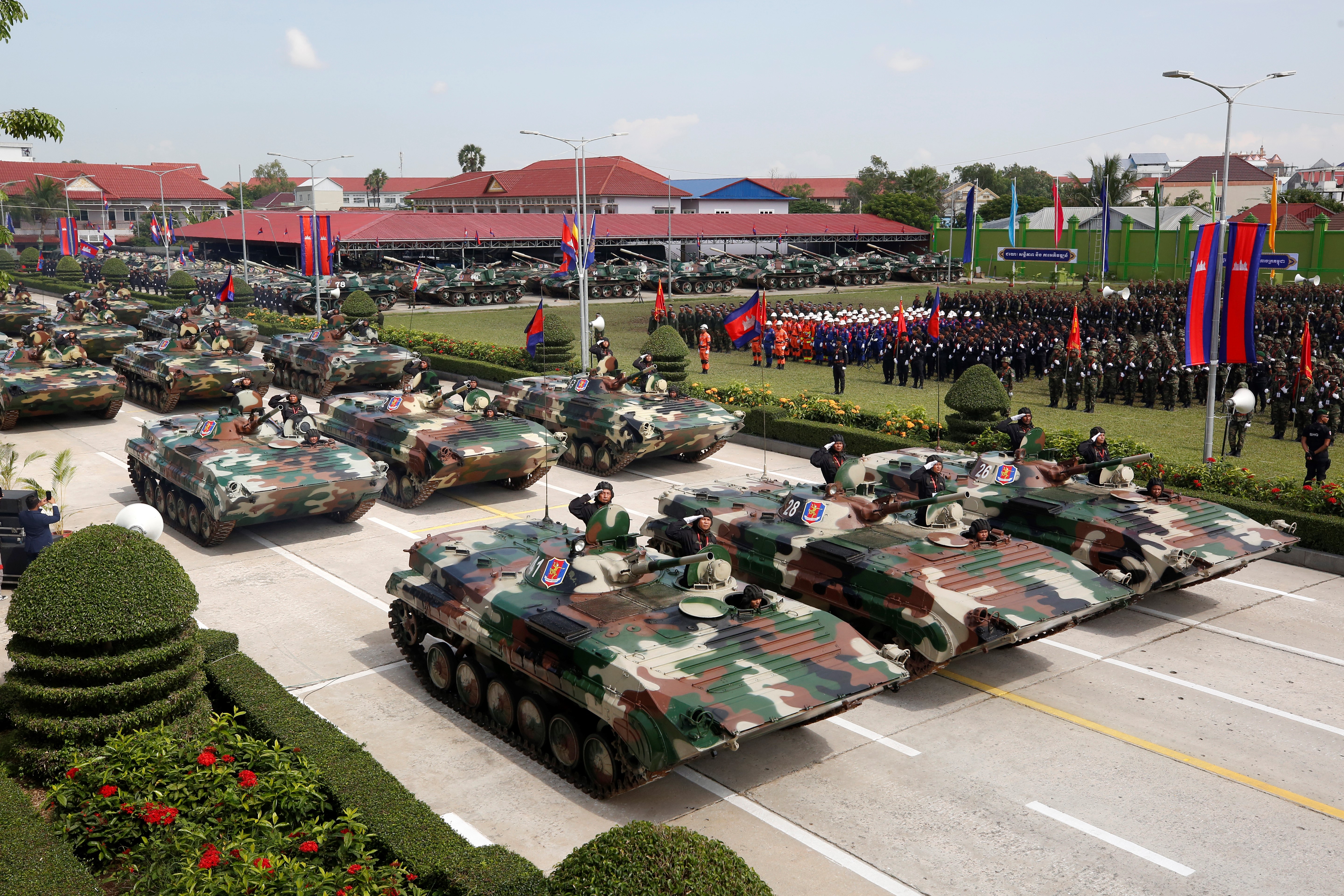 Military vehicles parade during the celebration of the 30th founding anniversary of the Brigade 70 in Phnom Penh, Cambodia on Oct. 15, 2024. The Brigade 70, an elite Royal Cambodian Armed Forces RCAF unit, commemorated its 30th founding anniversary on Tuesday, vowing to continue to safeguard the country's peace, security, stability and development.Cambodian Prime Minister Hun Manet presided over the ceremony, during which troops were on parade, displaying military trucks, weapons, armored vehicles, and tanks, among others. (Photo by Sovannara/Xinhua via Getty Images)
