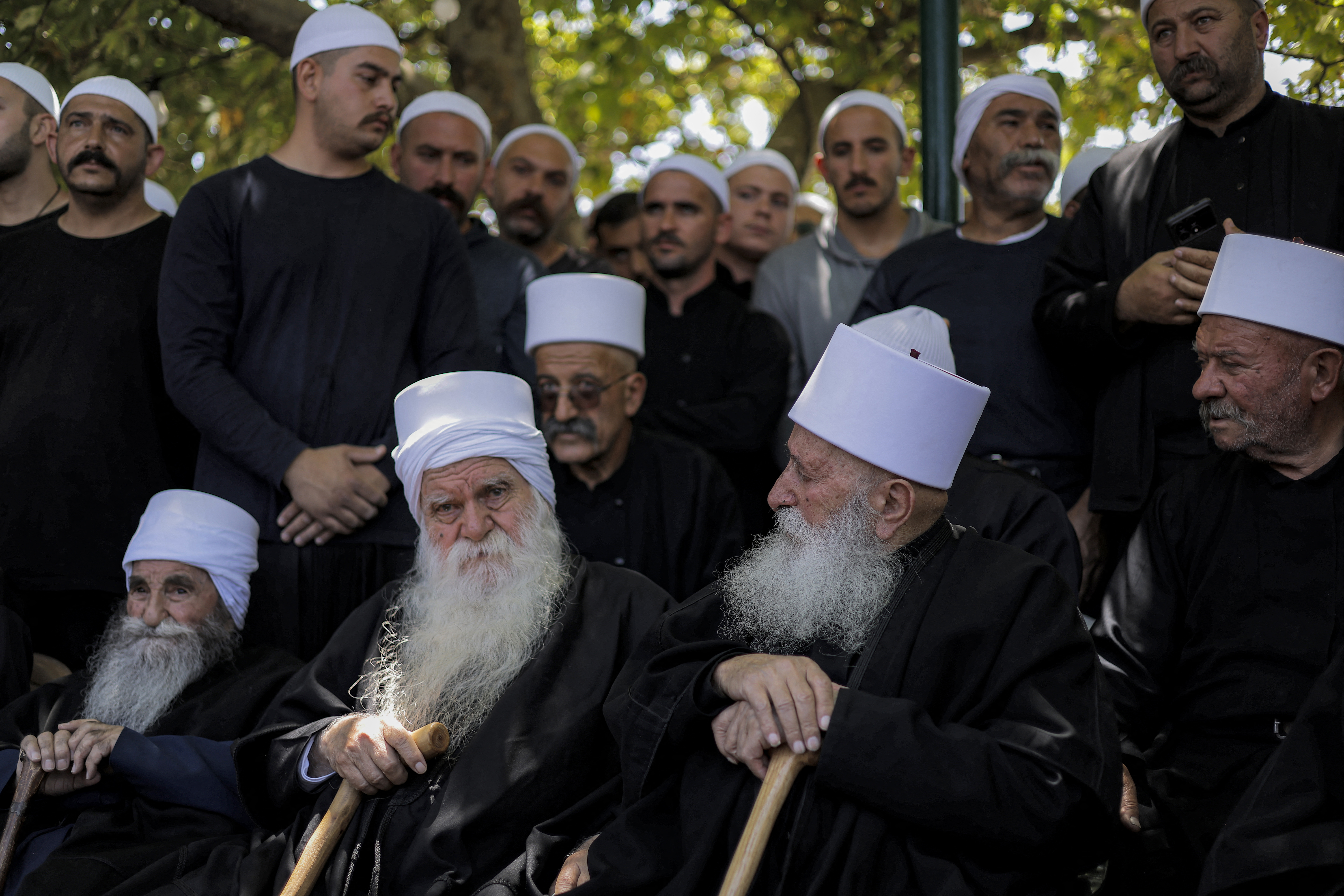 TOPSHOT - Elders of the Druze community gather during a meeting in the Druze village of Majdal Shams in the Israeli-annexed Golan Heights on July 16, 2025. Israeli troops on July 16 sought to control crowds and prevent Druze from crossing the border with Syria, after deadly violence in the country's south that prompted Damascus to send in government forces. (Photo by Jalaa MAREY / AFP) (Photo by JALAA MAREY/AFP via Getty Images)