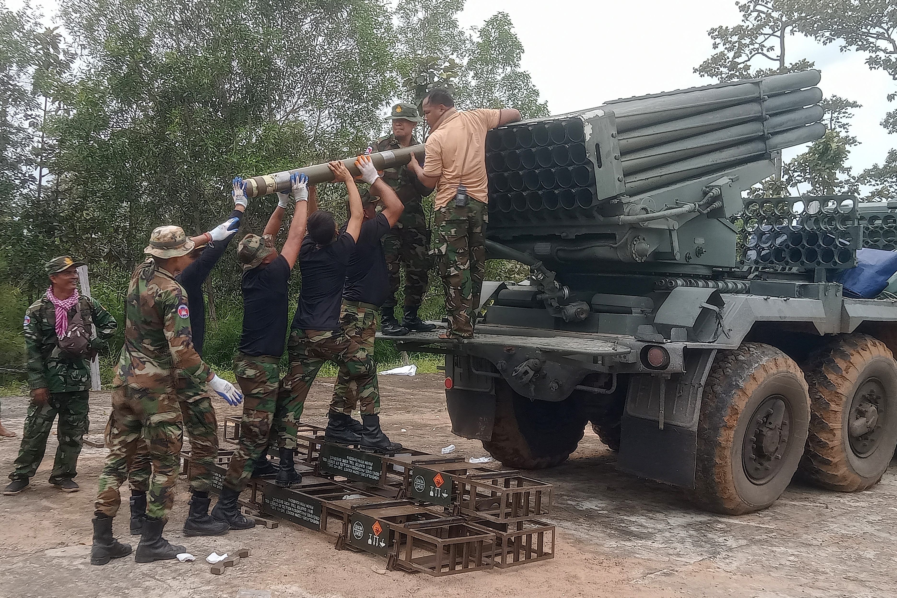 TOPSHOT - Cambodian soldiers reload the BM-21 multiple rocket launcher in Preah Vihear province on July 24, 2025. Thailand launched air strikes on Cambodian military targets on July 24 as Cambodia fired rockets and artillery, killing a civilian, in a dramatic escalation of a long-running border row between the two neighbours. (Photo by AFP) (Photo by STR/AFP via Getty Images)