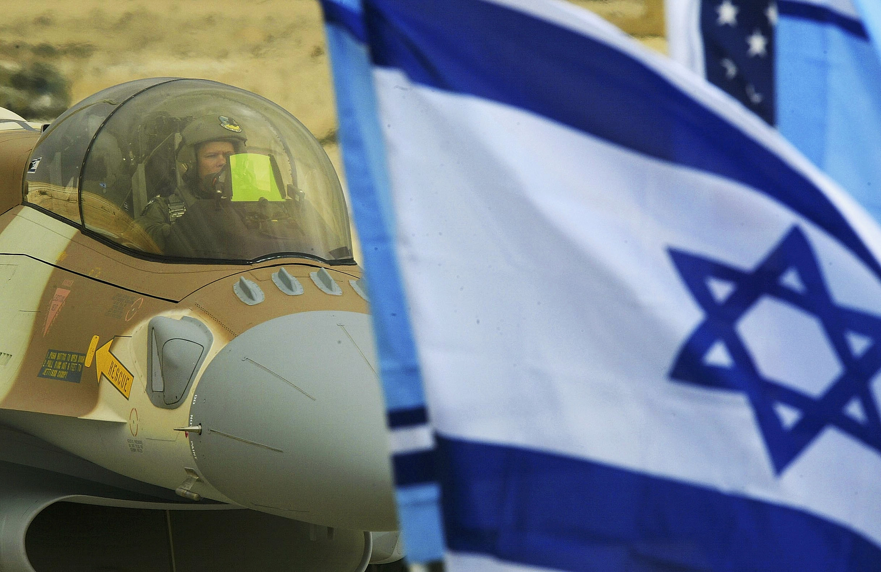 RAMON AIR FORCE BASE, ISRAEL - FEBRUARY 19: Israel's first F-16i jet fighter, piloted by an American pilot, taxis after landing February 19, 2004 at the Ramon Air Force Base in Israel's Negev desert. The air force took delivery of the first two of 102 of the long-range advanced American-made fighters which are intended to maintain the Jewish state's technological edge over its Arab neighbors. (Photo by David Silverman/Getty Images)