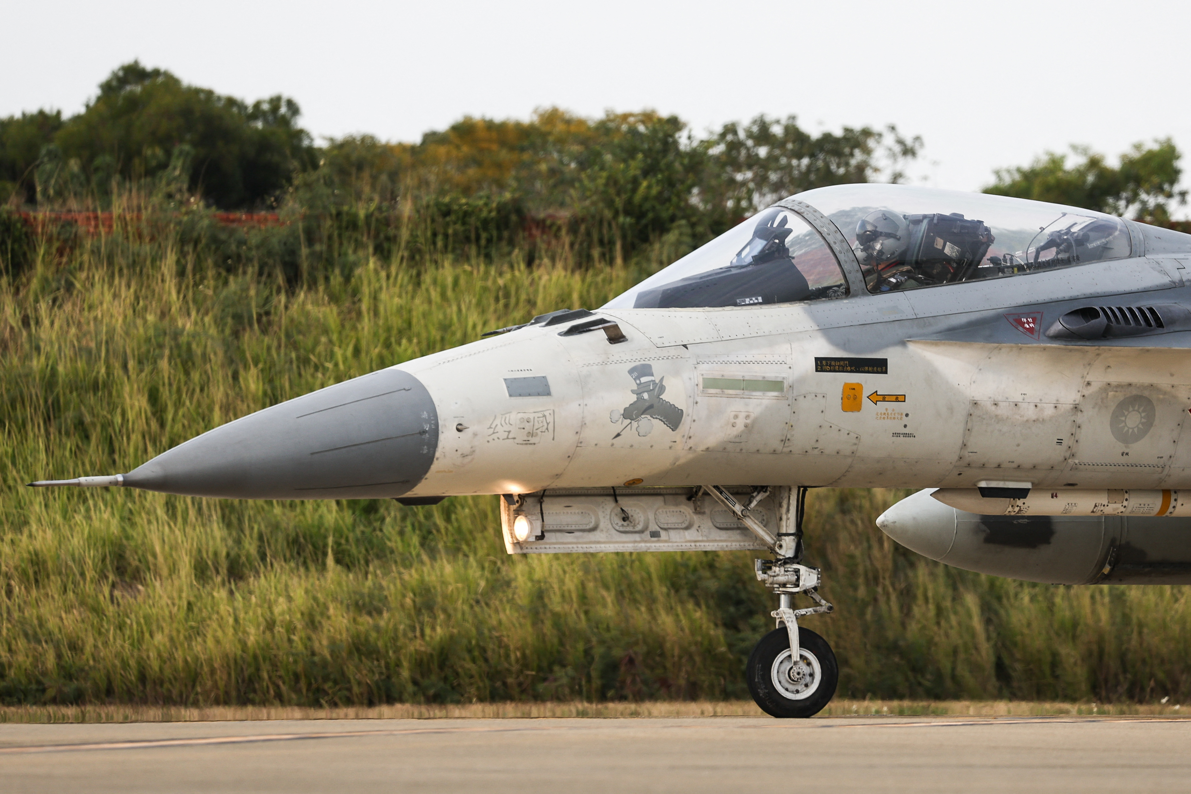 A Taiwanese air force pilot taxis his Indigenous Defense Fighter aircraft for take-off during a scramble as part of a combat readiness exercise at the Ching Chuan Kang Air Base in Taichung on January 7, 2025. (Photo by I-HWA CHENG / AFP) (Photo by I-HWA CHENG/AFP via Getty Images)