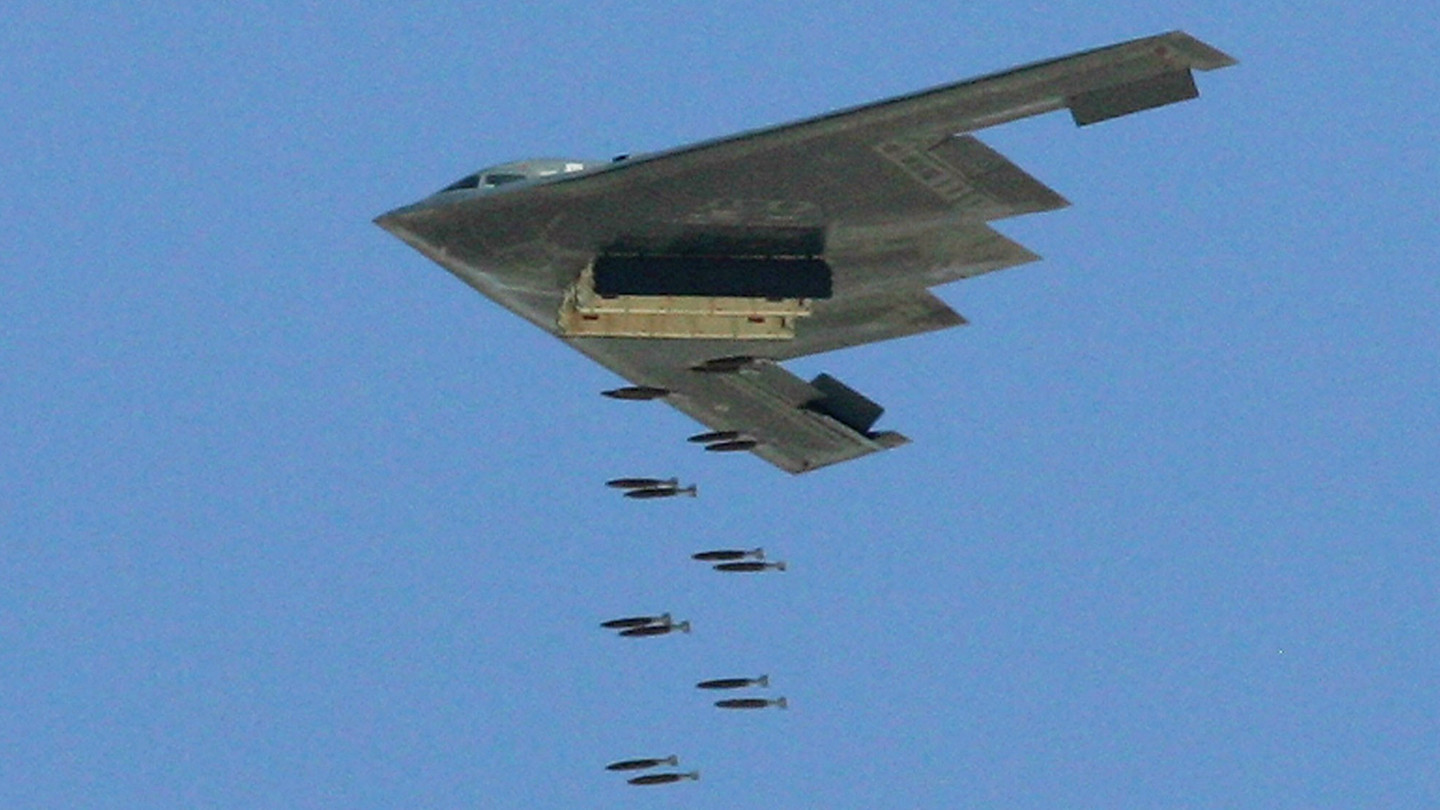 A B-2 bomber left a smiley face made out of bomb craters on the 'runway' of a mock airfield during a test some two decades ago.