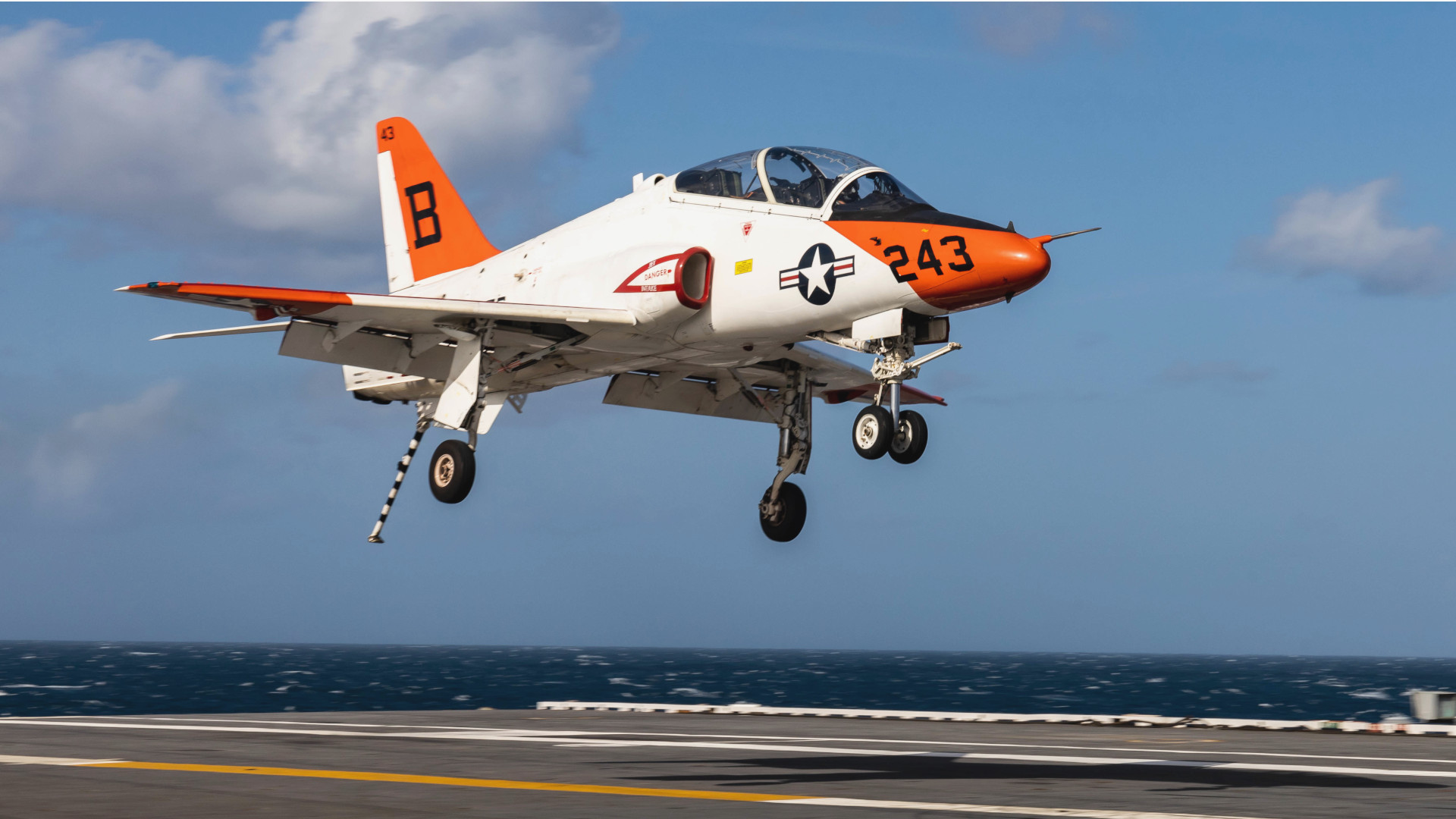 Individuals training to become U.S. Navy tactical jet pilots are no longer required to take off and land from aircraft carriers before being winged as Naval Aviators.