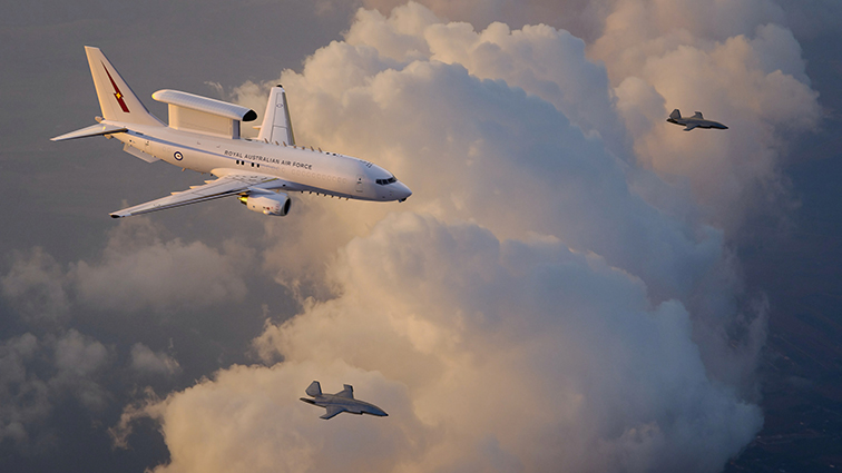 An artist’s rendering of a Royal Australian Air Force E-7A Wedgetail teaming with two MQ-28 Ghost Bat collaborative combat aircraft. (Boeing illustration)