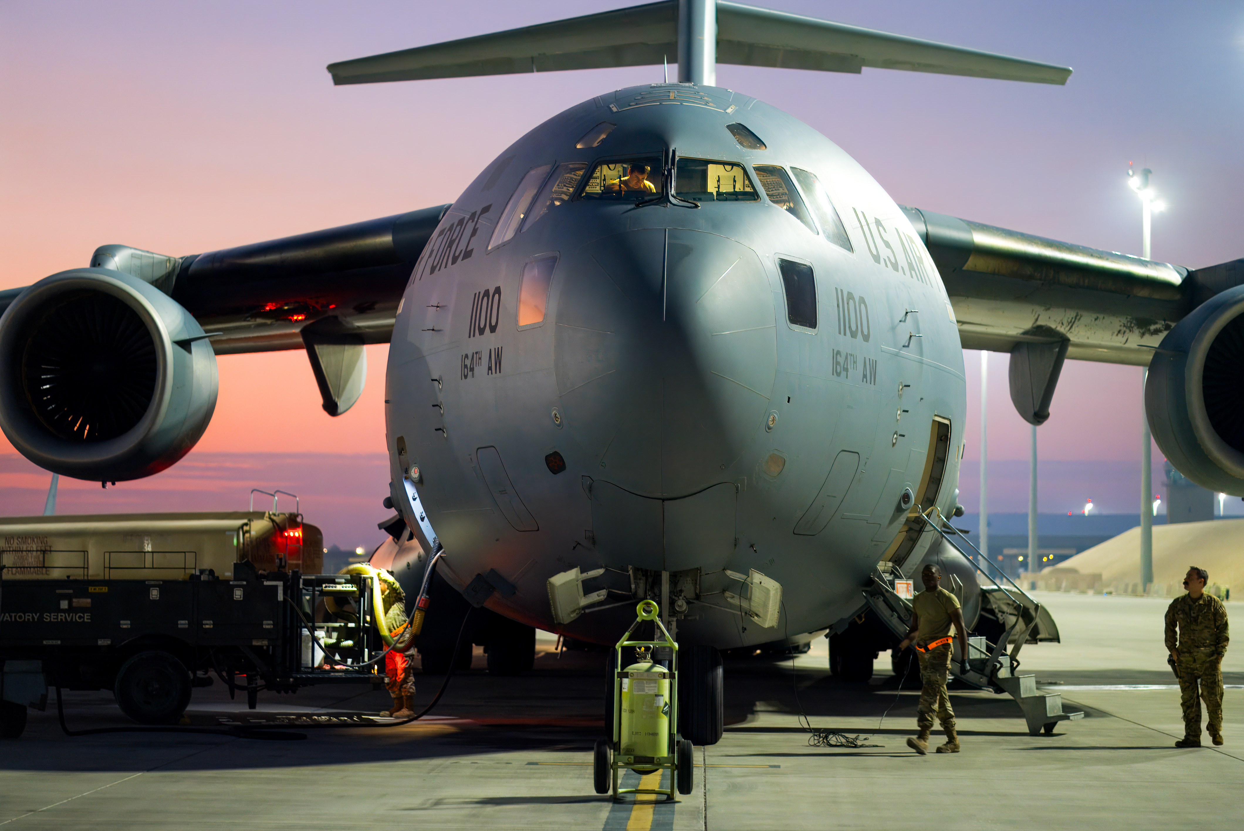 A C-17 Globemaster III with the 155th Airlift Squadron sits on the apron in Al Udeid Air Base, Qatar December 9, 2024. Aircrew with the 155th flew the aircraft to Al Udeid to transport soldiers and airmen who need medical attention to Ramstein Air Base, Germany. (U.S. Air National Guard photo by Senior Airman TraVonna Hawkins)