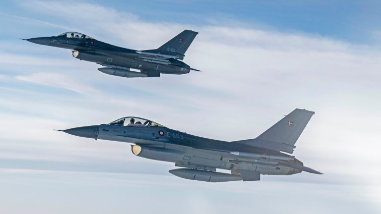 Royal Danish Air Force F-16 Fighting Falcons fly off the wing of a U.S. Air Force B-52H Stratofortress, assigned to the 20th Expeditionary Bomb Squadron, during a Bomber Task Force Europe 25-1 mission over the U.S. European Command area of responsibility, Nov. 15, 2024. Multinational exercises enhance interoperability with NATO forces, strengthening the collective ability to respond to global threats.