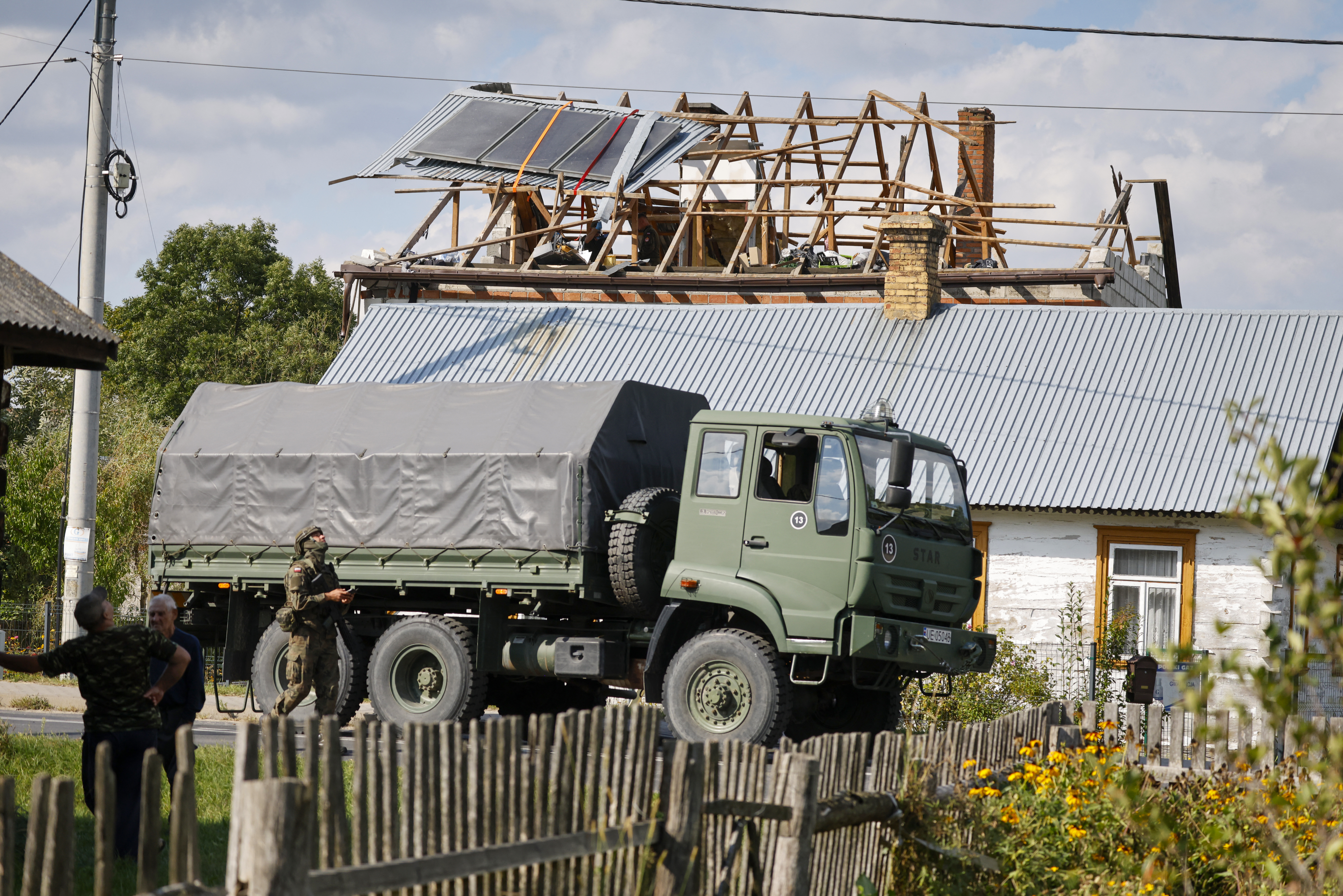 Police and army inspect damage to a house destroyed by debris from a shot down Russian drone in the village of Wyryki-Wola, eastern Poland, on September 10, 2025. NATO air defences helped counter drones that entered Polish airspace overnight and alliance chief Mark Rutte is in contact with Warsaw, a NATO spokeswoman said Wednesday. Polish Prime Minister Donald Tusk said Wednesday that a violation of Polish airspace by several Russian drones overnight was a major provocation aimed at the EU and NATO member. (Photo by Wojtek RADWANSKI / AFP) (Photo by WOJTEK RADWANSKI/AFP via Getty Images)