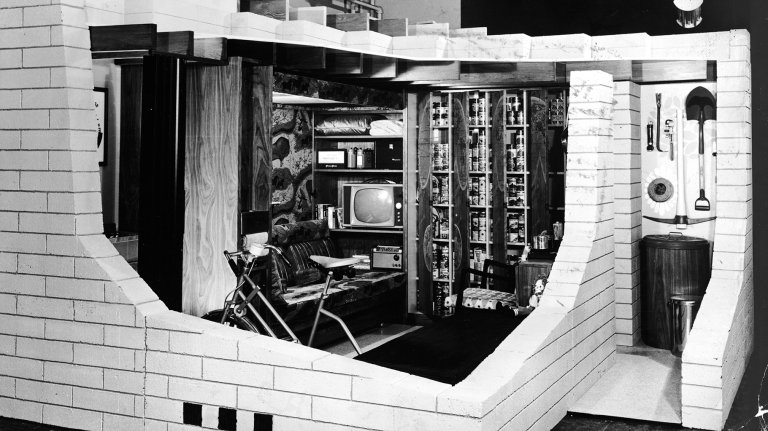 Cutaway display of a concrete masonry basement fallout shelter with an exercise bike, television and library, 1950s. (Photo by Pictorial Parade/Getty Images)