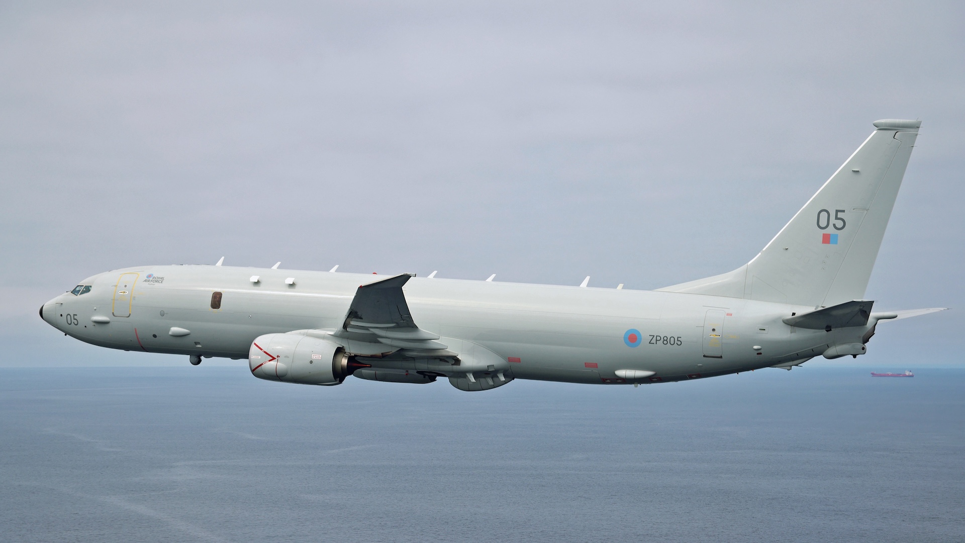 Image of a Royal Air Force Poseidon maritime patrol aircraft, seen here flying over RAF Lossiemouth. In a training flight conducted over the Moray Firth a Poseidon (P-8A) aircraft operated by 120 Sqn, based at RAF Lossiemouth, dropped a recoverable exercise variant of the Mark 54 Lightweight Torpedo, simulating an attack on a submarine. At just under 3m long and 32cm in diameter, the Mk 54 torpedo is small and light enough that five can be carried in the Poseidon's internal weapons bay. the high-explosive warheads on the live torpedoes pack a devastating punch sufficient to destroy enemy submarines that the Poseidon crew can locate and track using state-of-the-art equipment. The successful release of a torpedo is the latest milestone in the rapid development of the Poseidon in RAF service. Five Poseidon MRA1s are based at RAF Lossiemouth with a further four set to be delivered by the end of this year. The station, which is situated in close proximity to one of the aircraft's most frequent area of operations, is benefiting from a multi-million pound investment programme bringing significant economic benefits to the Highlands & Islands and Morayshire communities. The Poseidon is fitted with advanced, state-of-the-art, Anti-Submarine Warfare and Anti-Surface Warfare sensors which will provide global protection to UK, NATO and our Allies' submarines and warships in an increasingly dangerous world.