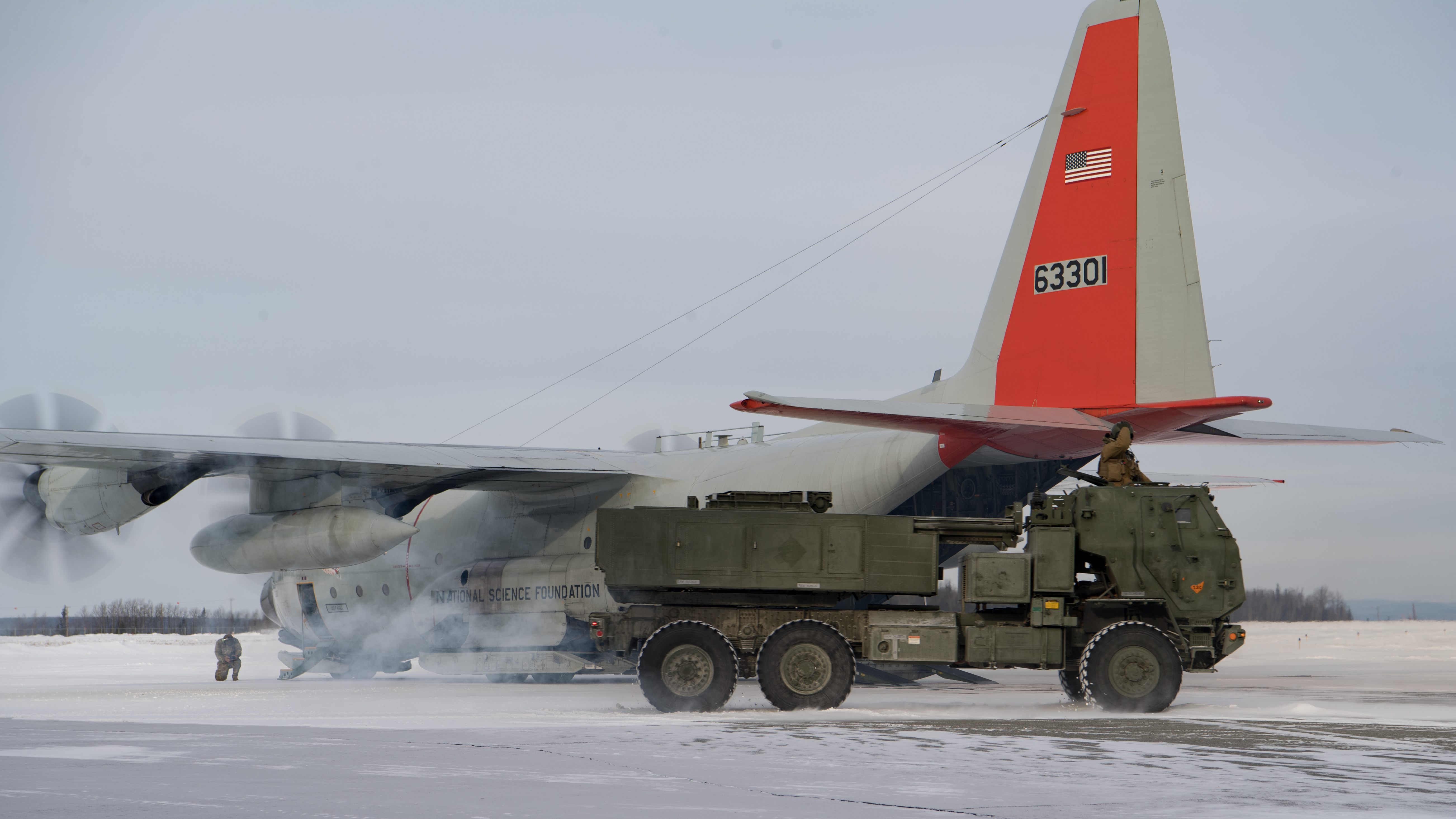 U.S. Marines with 5th Battalion, 11th Marine Regiment, load a M142 High Mobility Artillery Rocket System (HIMARS) onto a U.S. Air Force LC-130H assigned to the 109th Airlift Wing of the New York Air National Guard during U.S. Northern Command’s Exercise Arctic Edge. Arctic Edge 2020 is a North American Aerospace Defense Command and U.S. Northern Command exercise scheduled every two years. The exercise focuses on training, experimentation, techniques, tactics, and procedures development for Homeland Defense operations in an Arctic environment. Arctic Edge 20 provides opportunities to validate Arctic capabilities. (U.S. Air Force photo by Tech. Sgt. Amy Picard)