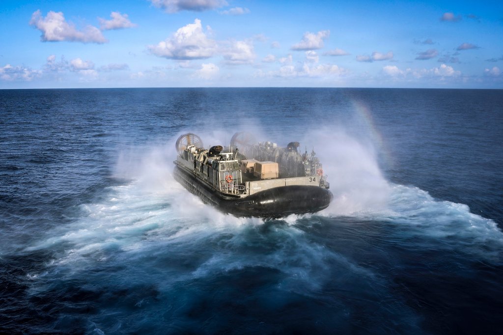 CARIBBEAN SEA (Oct. 15, 2025) A landing craft, air cushion, assigned to Assault Craft Unit 4, departs from the well deck of the Wasp-class amphibious assault ship USS Iwo Jima (LHD 7) while underway in the Caribbean Sea, Oct. 15, 2025. U.S. military forces are deployed to the Caribbean in support of the U.S. Southern Command mission, Department of War-directed operations, and the president’s priorities to disrupt illicit drug trafficking and protect the homeland. (U.S. Navy photo by Mass Communication Specialist Seaman Andrew Eggert)