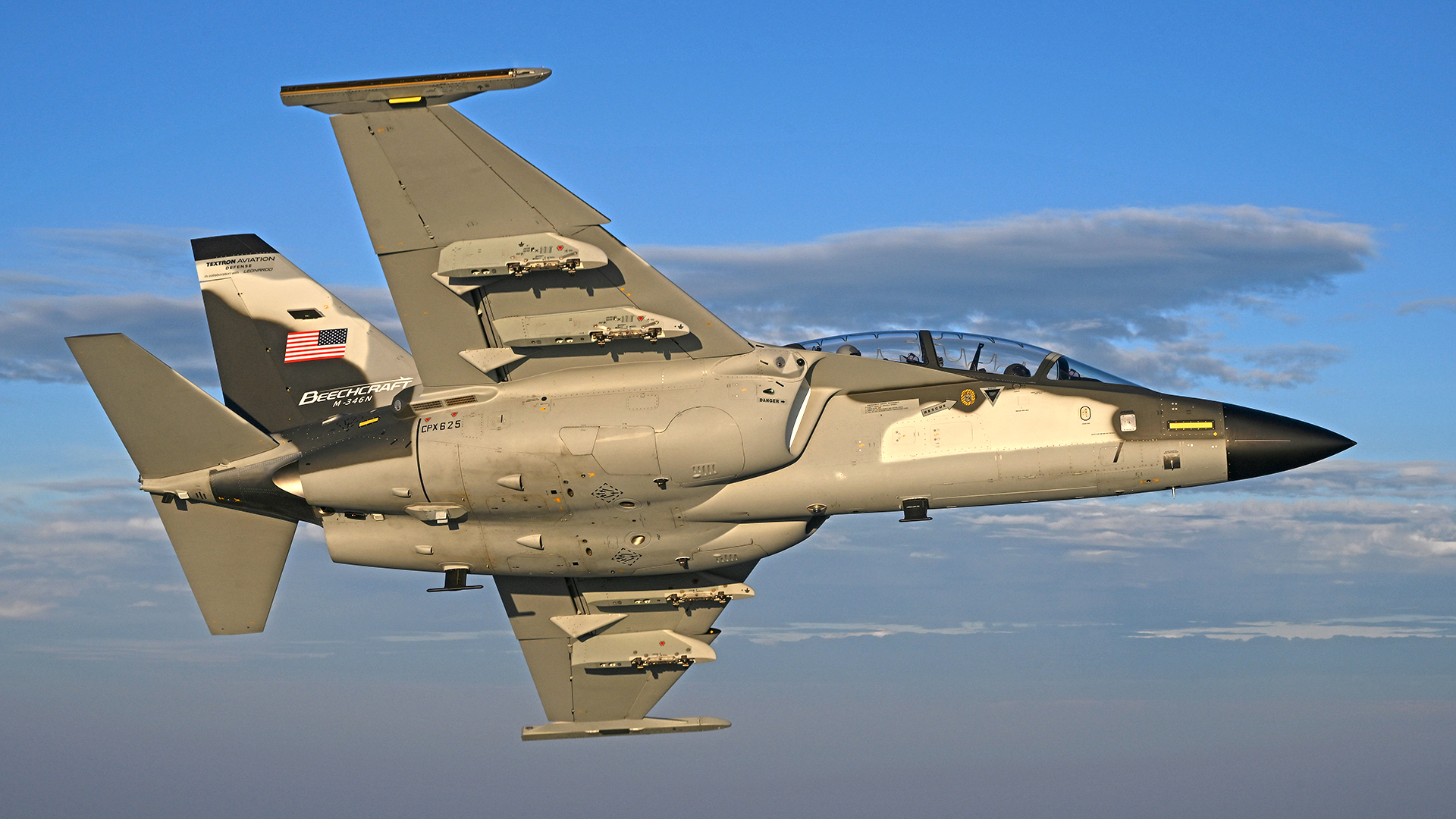 Beechcraft M-346N in-flight over Wichita, Kansas and surrounding area on Sept. 15, 2025. The aircraft is being flown by Leonardo test pilots Quirino Bucci, front seat, and Emiliano Battistelli, back seat, wtih chase from a Beechcraft AT-6E Wolverine flown by Textron Aviation Engineering/Defense Chief Pilot Stuart Rogerson. (Textron Aviation Defense / Greg L. Davis) The M-346N is the proposed replacement for the T-45 Goshawk jet trainer for the U.S. Navy's Undergraduate Jet Training System and a product prepared for competition by Beechcraft in collaboration with Leonardo of Italy.
