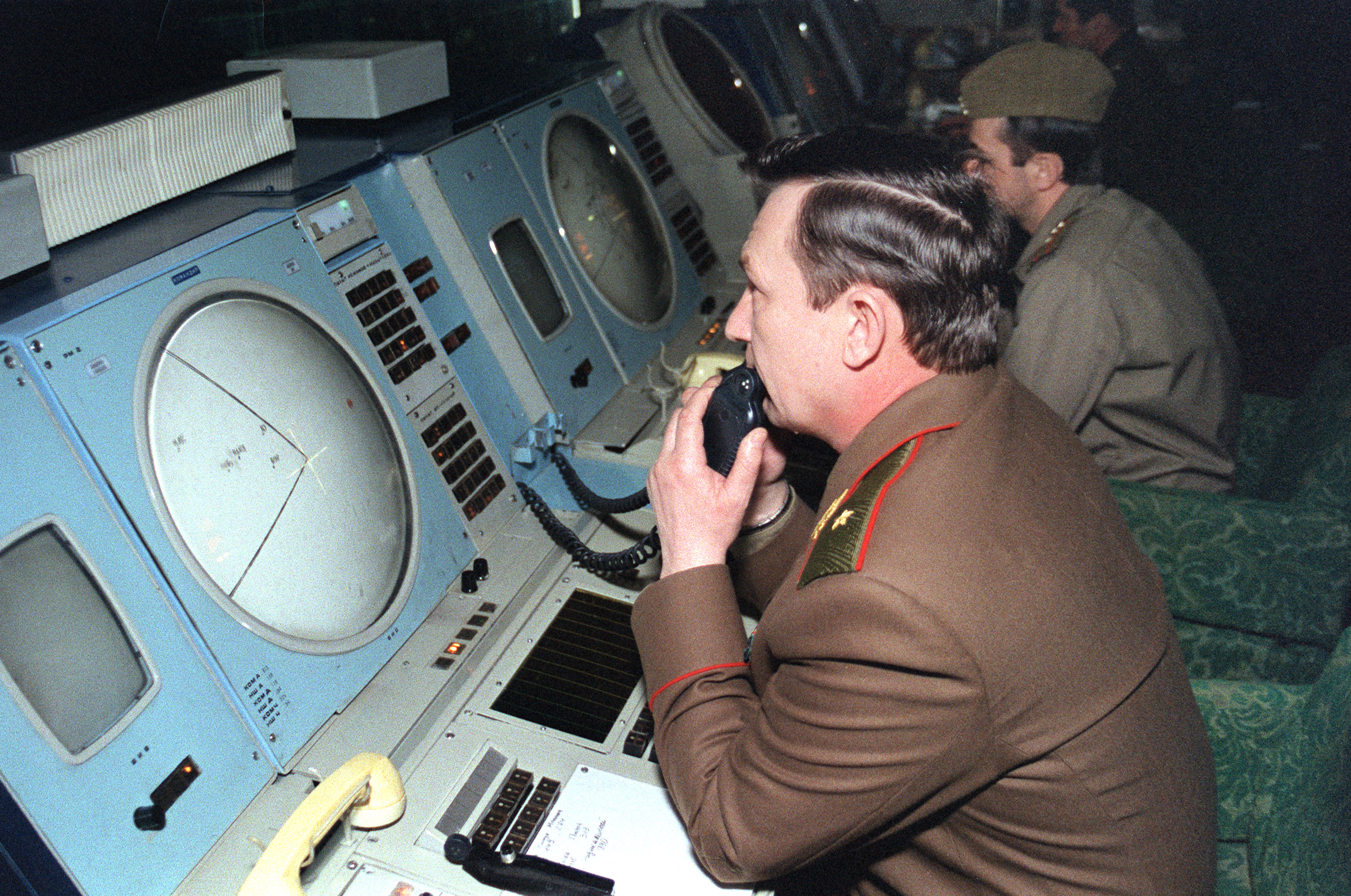 A Russian strategic nuclear forces (SNF) officers monitor the trajectories on screens at a missile combat center in a underground bunker of the launching center of intercontinental ballistic missiles 02 April 1992 in Dolgoprudny, a closed army town in Moscow region. The strategic nuclear forces of the Russian Federation consist of ground intercontinental ballistic missiles (IBM) stationary, and also mobile, earth and railway variants of basing, sea and aviation strategic nuclear arms. AFP PHOTO GERDO (Photo by gerdo / AFP) (Photo by GERDO/AFP via Getty Images)