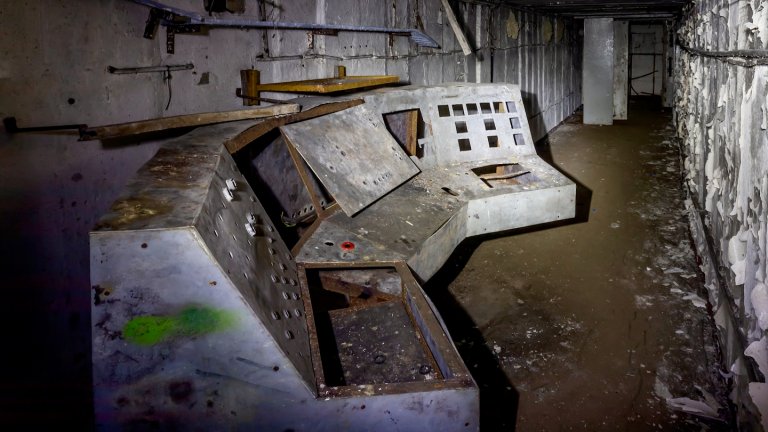 Tunnel in an old abandoned military bunker with old control unit