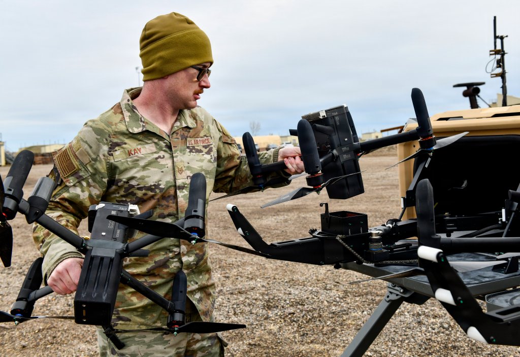 Tech. Sgt. Ian Kay, a member of the U.S. Northern Command Counter-small Unmanned Aerial System fly-away kit team, sets an Anvil drone interceptor on its platform during an exercise at Minot Air Force Base, N.D., Oct. 27, 2025. The team demonstrated its ability to rapidly deploy with the equipment to support an installation experiencing drone incursions. (Department of Defense photo by John Ingle)