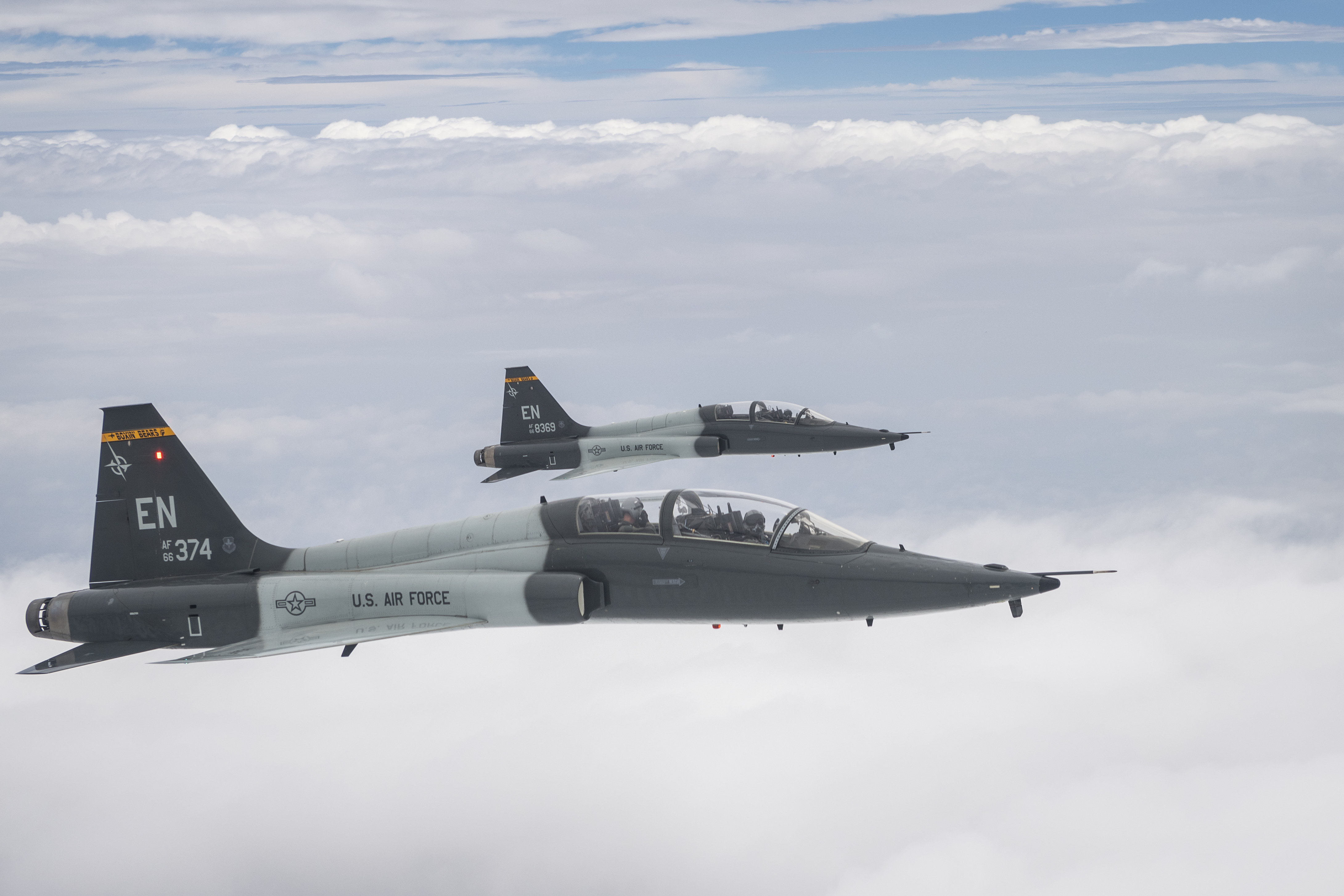 U.S. Air Force U.S. Air Force Capt. Tyler “Rico” Parker, front, and Romanian Air Force Maj. Alex Sandulache, instructor pilots assigned to the 90th Flying Training Squadron, operate U.S. Air Force T-38C Talon aircraft above Wichita Falls, Texas, July 21, 2022. The 90th FTS, a unit of the 80th Flying Training Wing, aids in instructing students in the Euro-NATO Joint Jet Pilot Training Program. The ENJJPT program, conducted by the 80th FTW, is the world's only multi-nationally manned and managed flying training program chartered to produce combat pilots for NATO. (U.S Air Force photo by Staff Sgt. Joseph Pick)