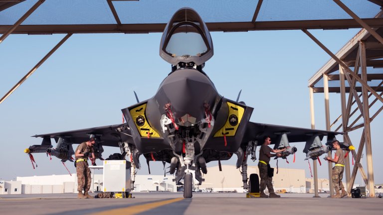 ‘Crew One,’ a three-man weapons load team, completes the first full external loadout with live munitions for the F-35A Lightening II May 3, 2019, at Al Dhafra Air Base, United Arab Emirates. F-35A Lightning IIs assigned to the 4th Expeditionary Fighter Squadron were configured in a full external live loadout of six GBU-49 small glide munitions and two AIM-9x Sidewinder missiles to execute an operation in Southwest Asia.
