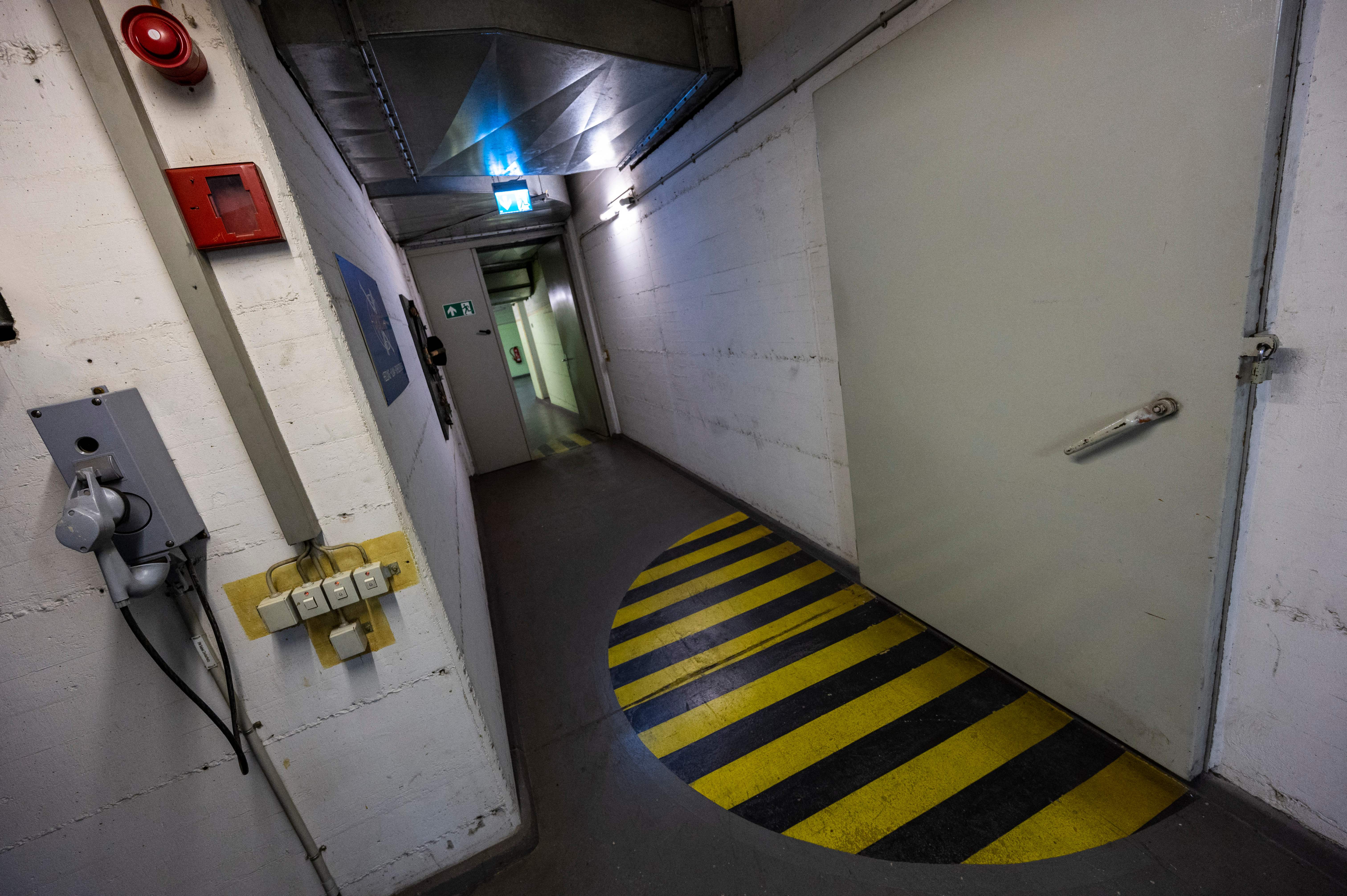 This picture shows a corridor in the Pankstrasse nuclear fallout shelter in Berlin on May 10, 2022. - Built in 1977 during the Cold War, this multi-purpose facility was intended to protect the citizens of West Berlin in case of a nuclear conflict. The bunker serves not only as an U-Bahn stop for commuters but also, in an emergency, could have sheltered 3,339 people for up to two weeks. (Photo by John MACDOUGALL / AFP) (Photo by JOHN MACDOUGALL/AFP via Getty Images)