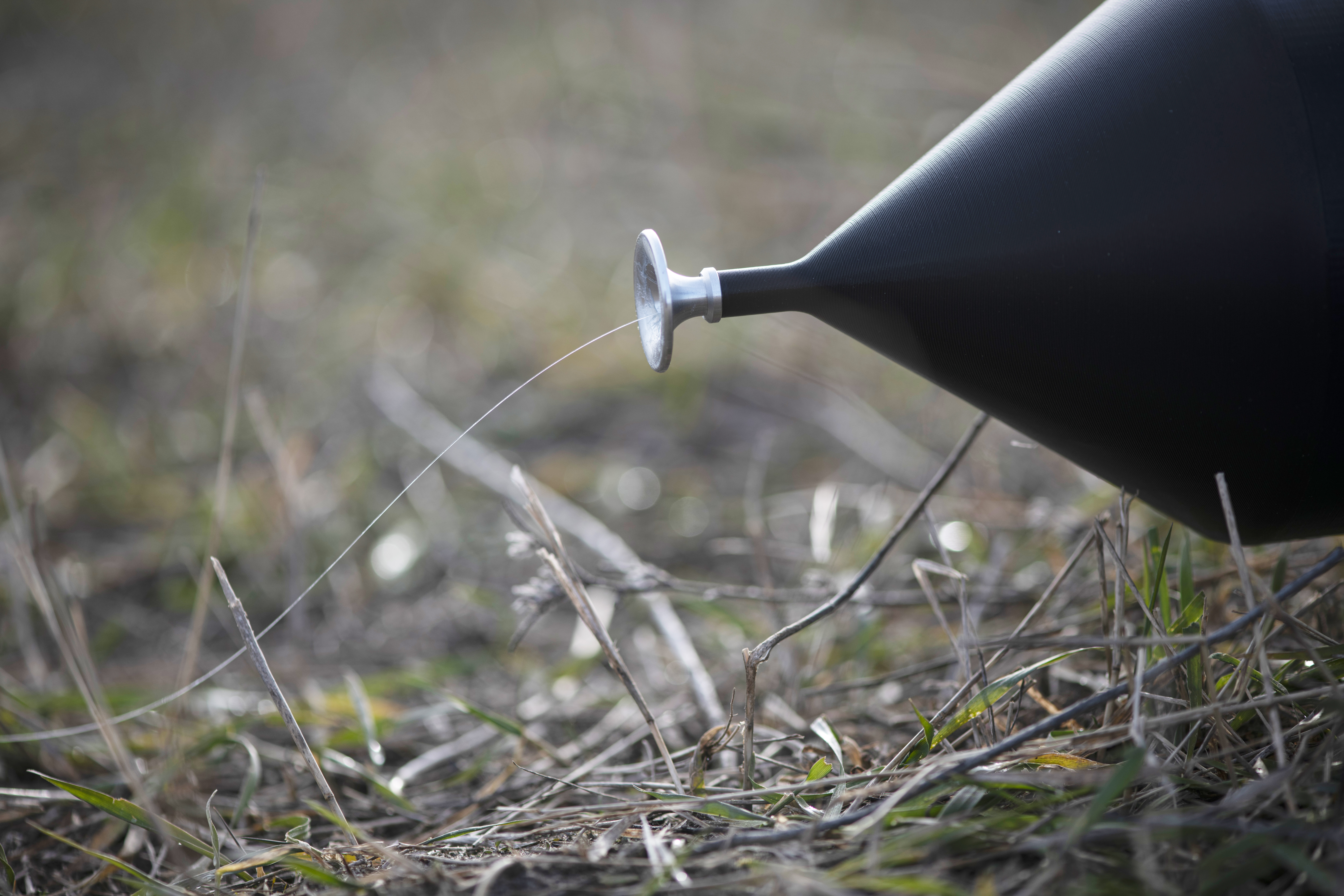 KYIV OBLAST, UKRAINE - DECEMBER 26: A drone controlled via a fiber-optic cable is seen during a test flight on December 26, 2024 in Kyiv Oblast, Ukraine. The Main Department of Defence Innovations of the Ministry of Defence of Ukraine, as part of the programs for the implementation of innovations and the development of the army of the future, conducted a presentation test of FPV drones controlled via a fiber optic cable for representatives of the commands of certain branches of the Armed Forces of Ukraine. During the event, Ukrainian manufacturers presented more than a dozen models of drones, some of which can carry up to 3 kg of payload. The demonstration flights were directly observed by experienced UAV operators, potential users of the latest technology on the battlefield during ongoing Russian-Ukrainian war. (Photo by Viktor Fridshon/Global Images Ukraine via Getty Images)